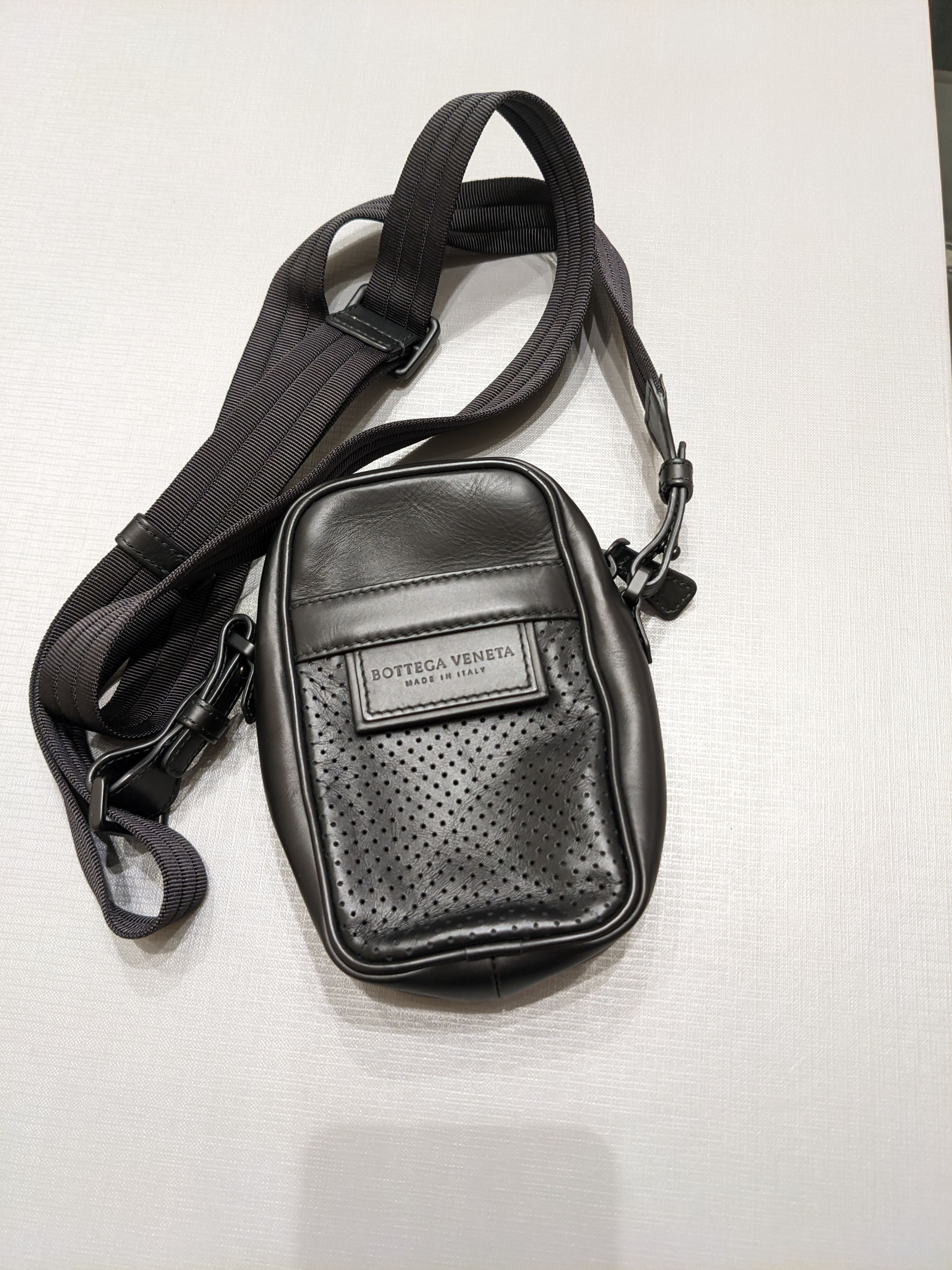 o1rshd10124 Cross Body Perforated Bag in Black