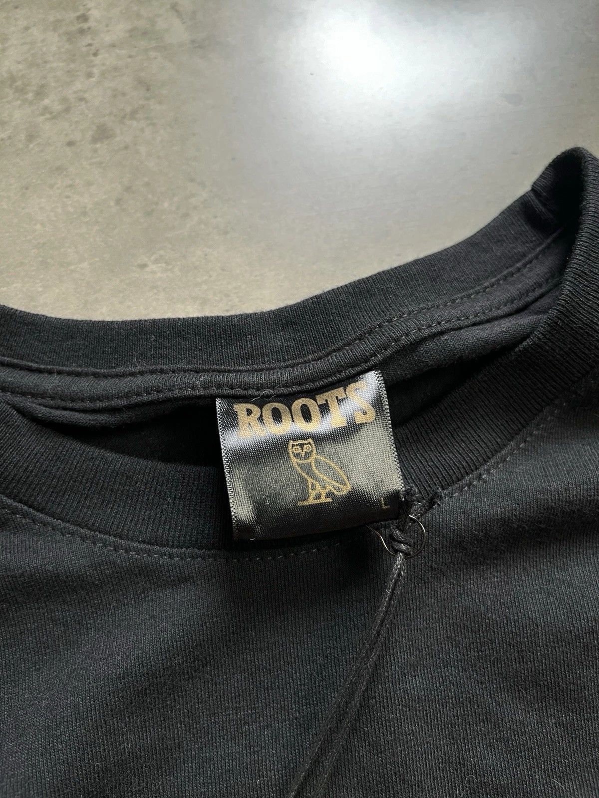 October's Very Own × Roots OVO October's Very Own x Roots Owl Tee Size US L / EU 52-54 / 3 - 9 Thumbnail