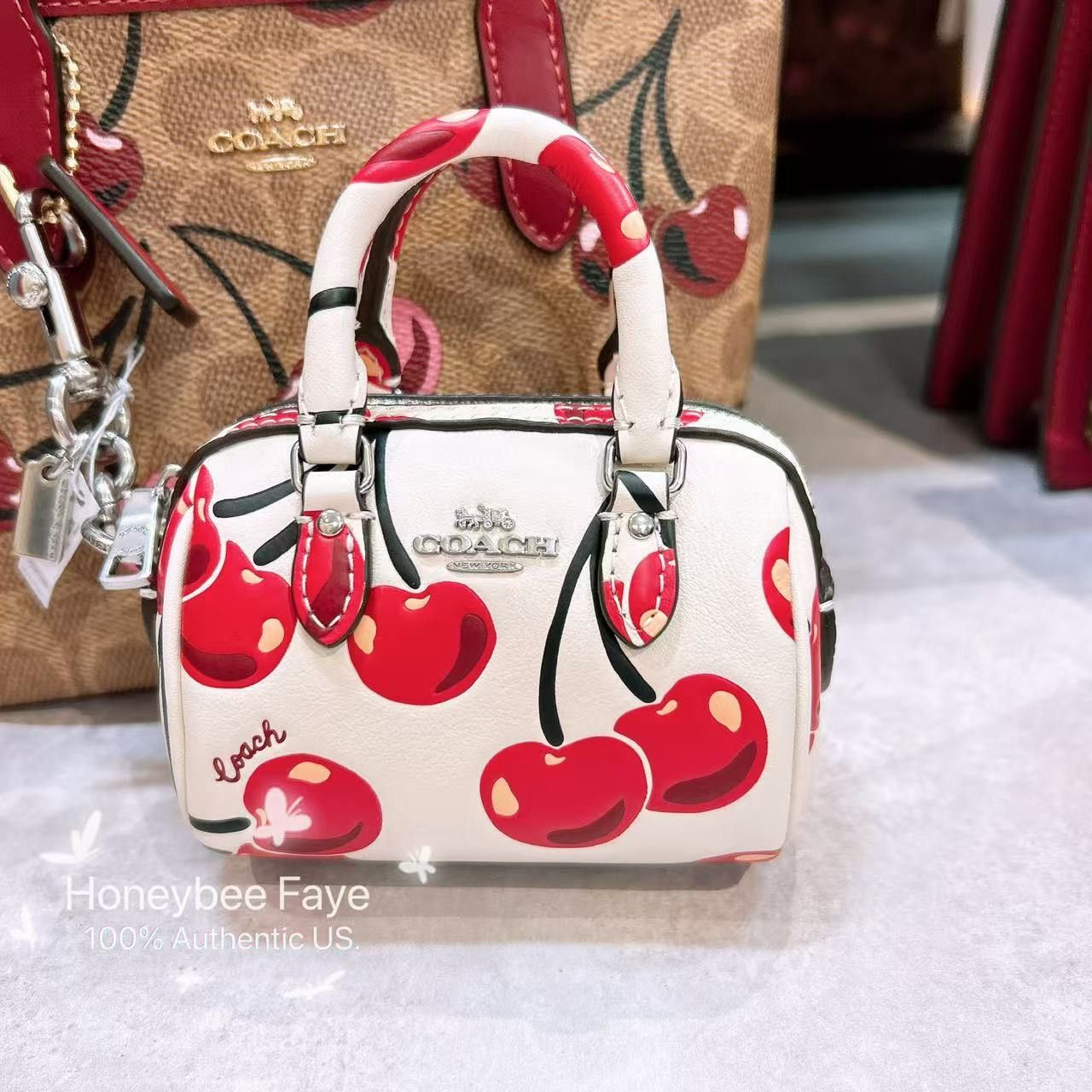 Coach 🍒 Mini Rowan Bag Charm With Cherry Print CZ082 Size ONE SIZE - 1 Thumbnail