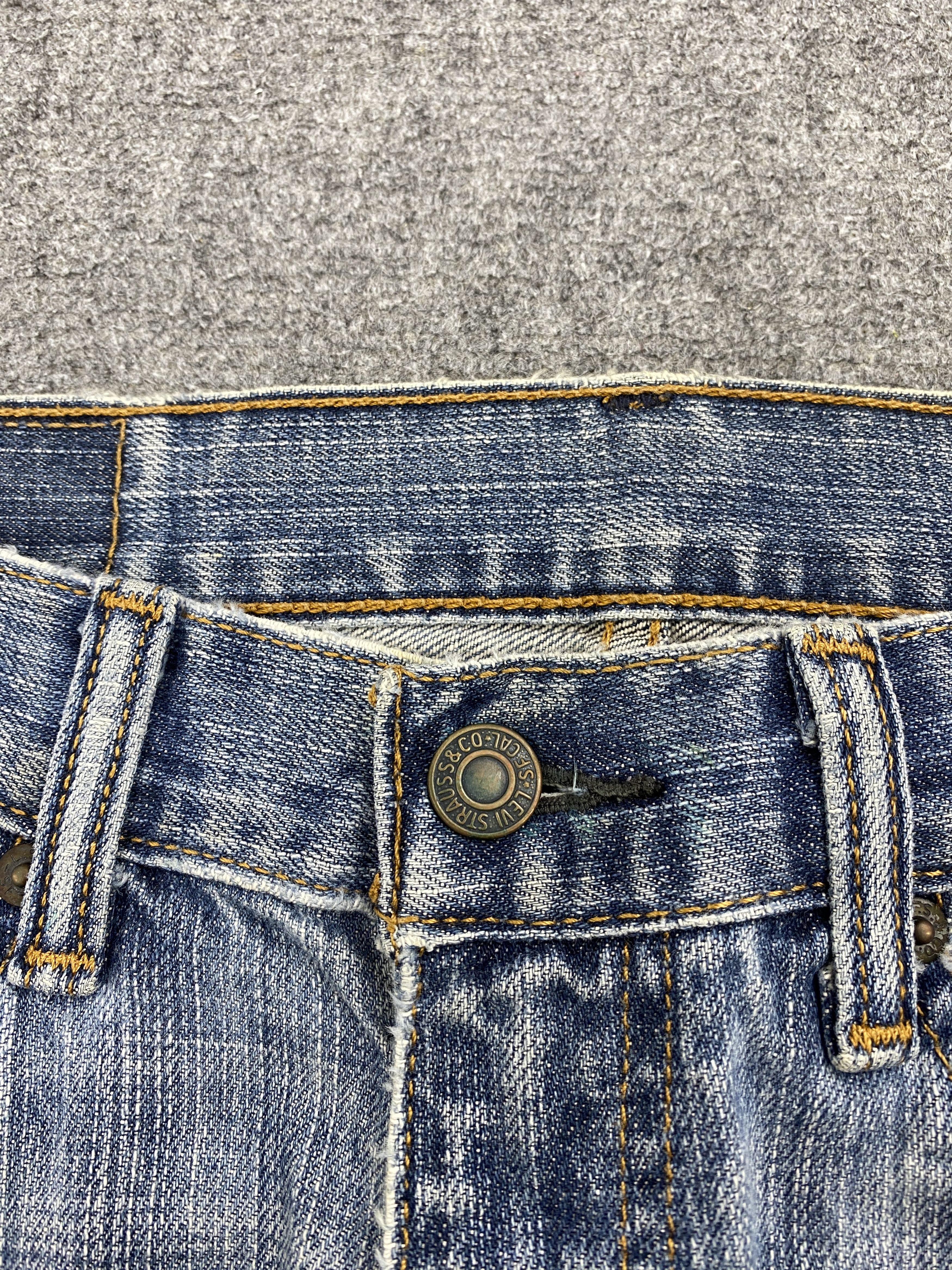 Distressed Vintage Levi's 505 Faded Blue Jeans
