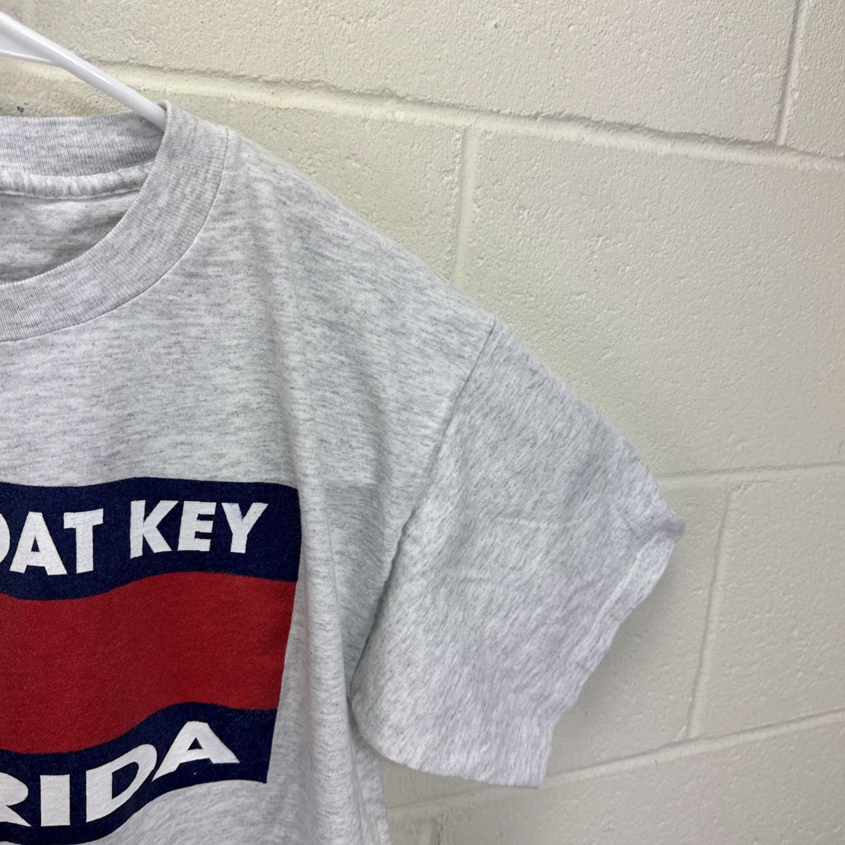 Tommy Hilfiger Vintage Murina LONGBOAT KEY FLORIDA T-SHIRT Gray Unisex Adults L Crew Neck Short Sleeve 90s USA Flag Graphic Floral Pattern? Wait no dais. Size US L / EU 52-54 / 3 - 7 Thumbnail