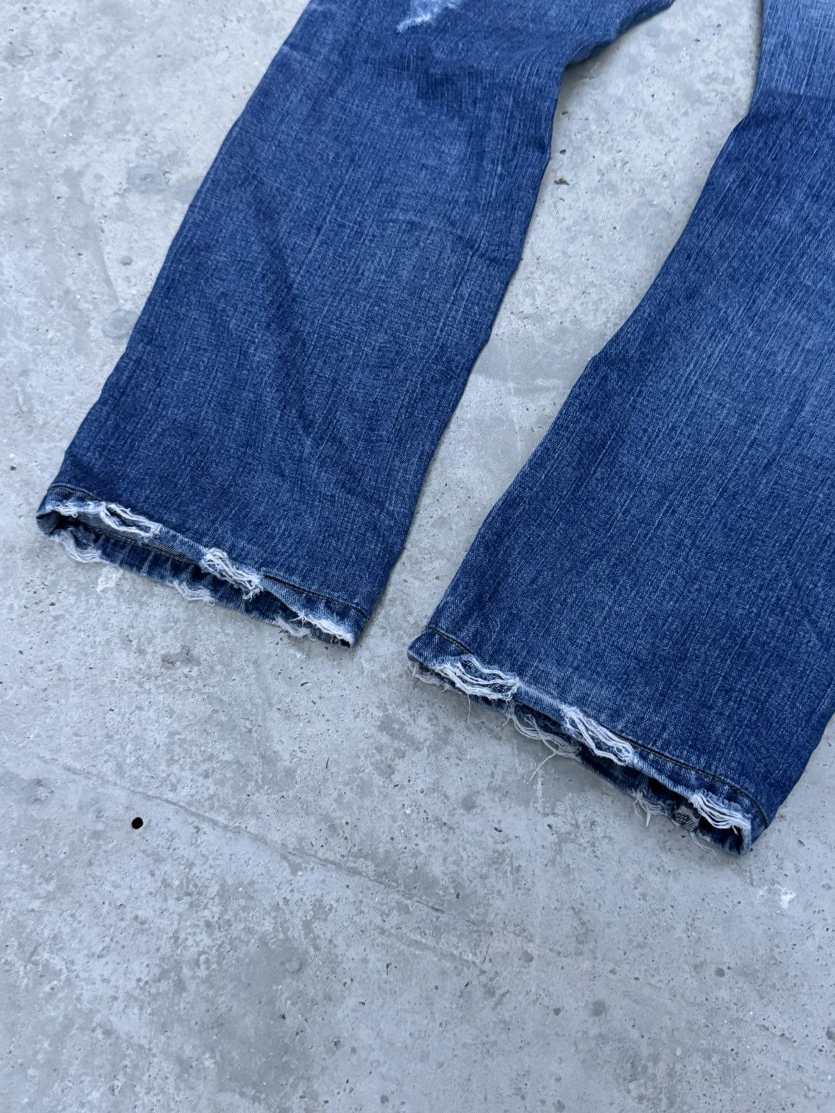 VINTAGE DISTRESSED WINGS DENIM JEANS