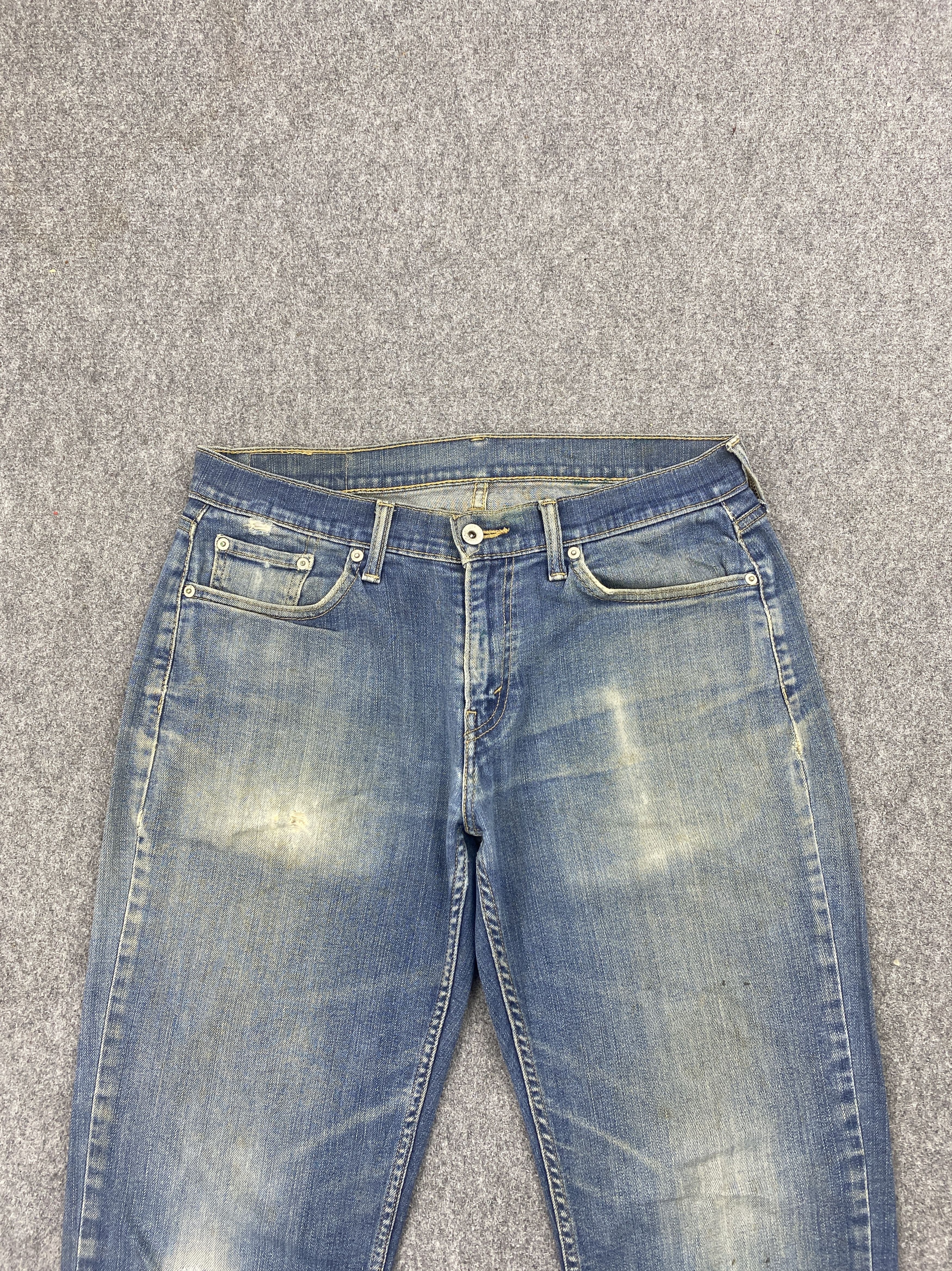 Distressed Vintage Levi's 514 Faded Blue Jeans