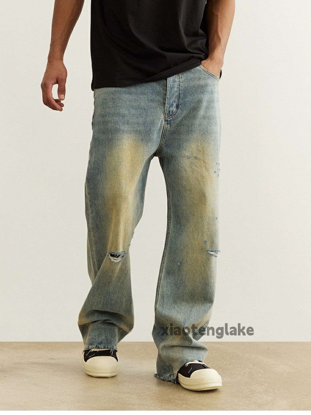 dirty washed faded damaged stain ripped jeans