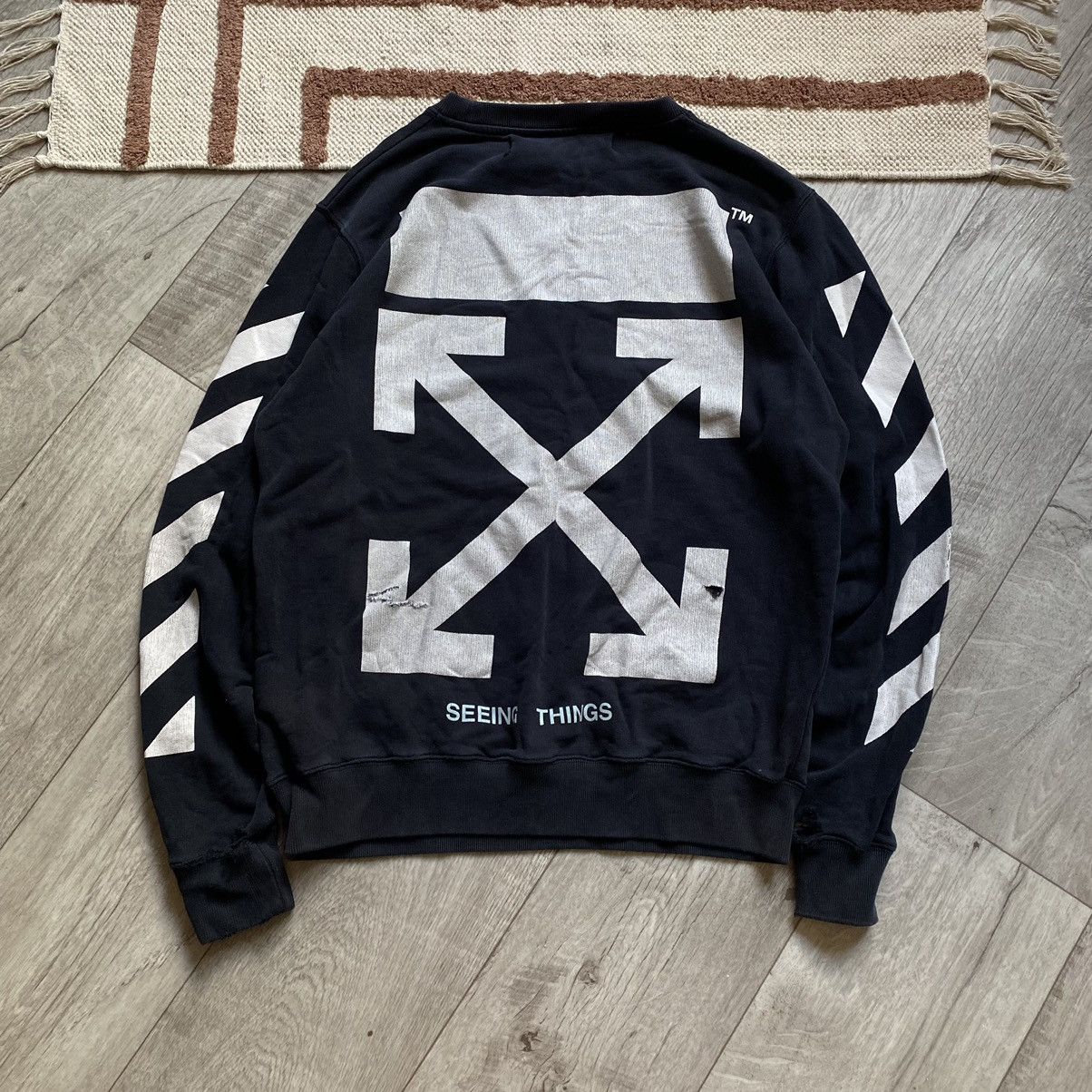 Off white sweater seeing things online