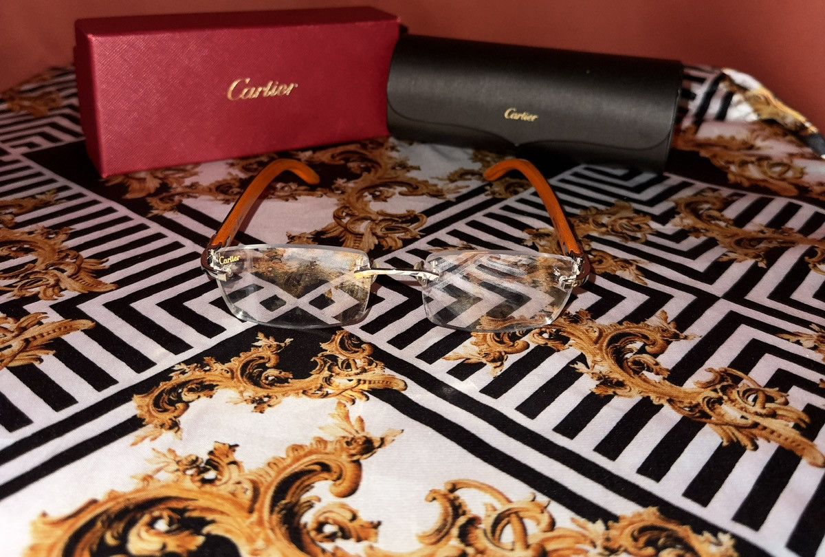 image of Cartier Rimless C Decor Glasses in Black, Men's