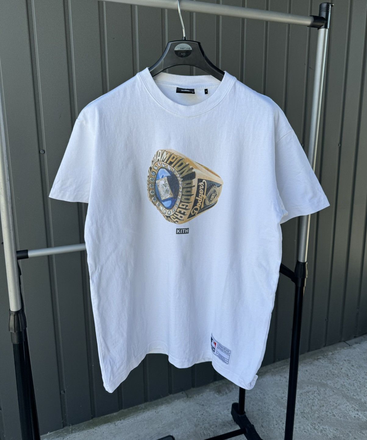 Kith champion t shirt best sale