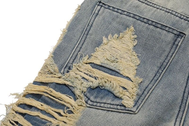 Ripped frayed hole blue washed baggy trousers jeans