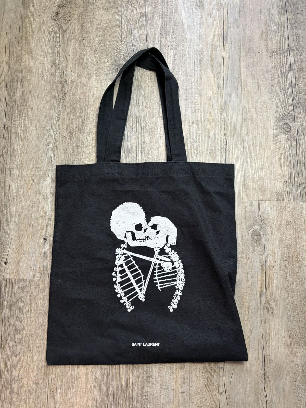 Saint Laurent Paris Saint Laurent Skeleton Kiss Print Canvas Tote Bag in Black Size ONE SIZE - 1 Thumbnail