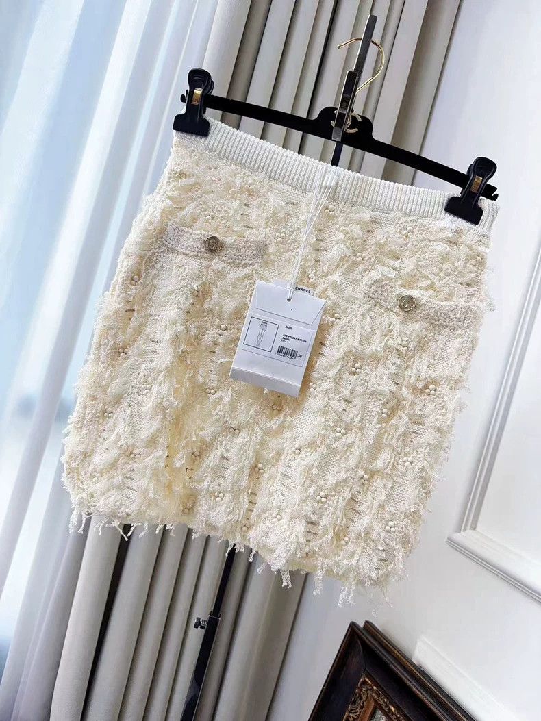 Chanel 21s show beige heavy industry stud bead embroidery