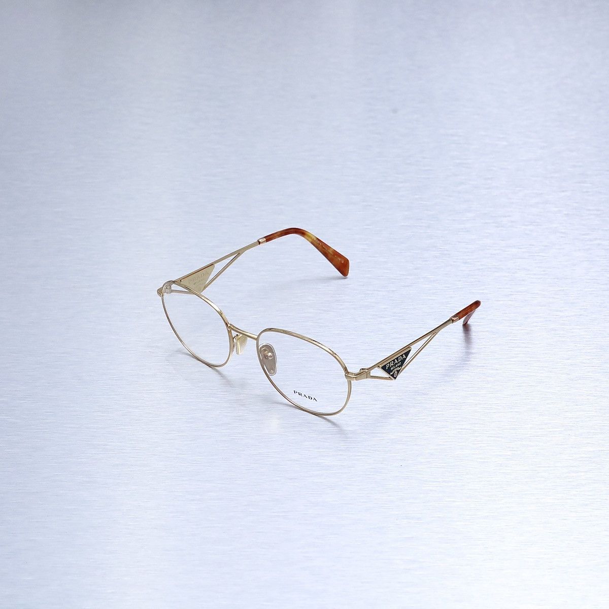 image of Prada 0Pr A50V Glasses in Gold, Women's