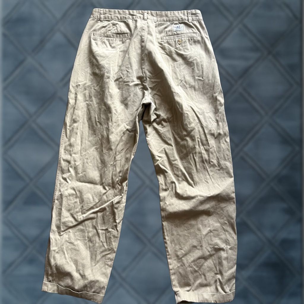 American Eagle Outfitters AMERICAN EAGLE OUTFITTERS pleated chino pants 34x30 tag talon vtg 70s 80s Men Beige Cotton Belt Loops Zip Tapered 80s Chino Vintage Size US 34 / EU 50 - 1 Thumbnail