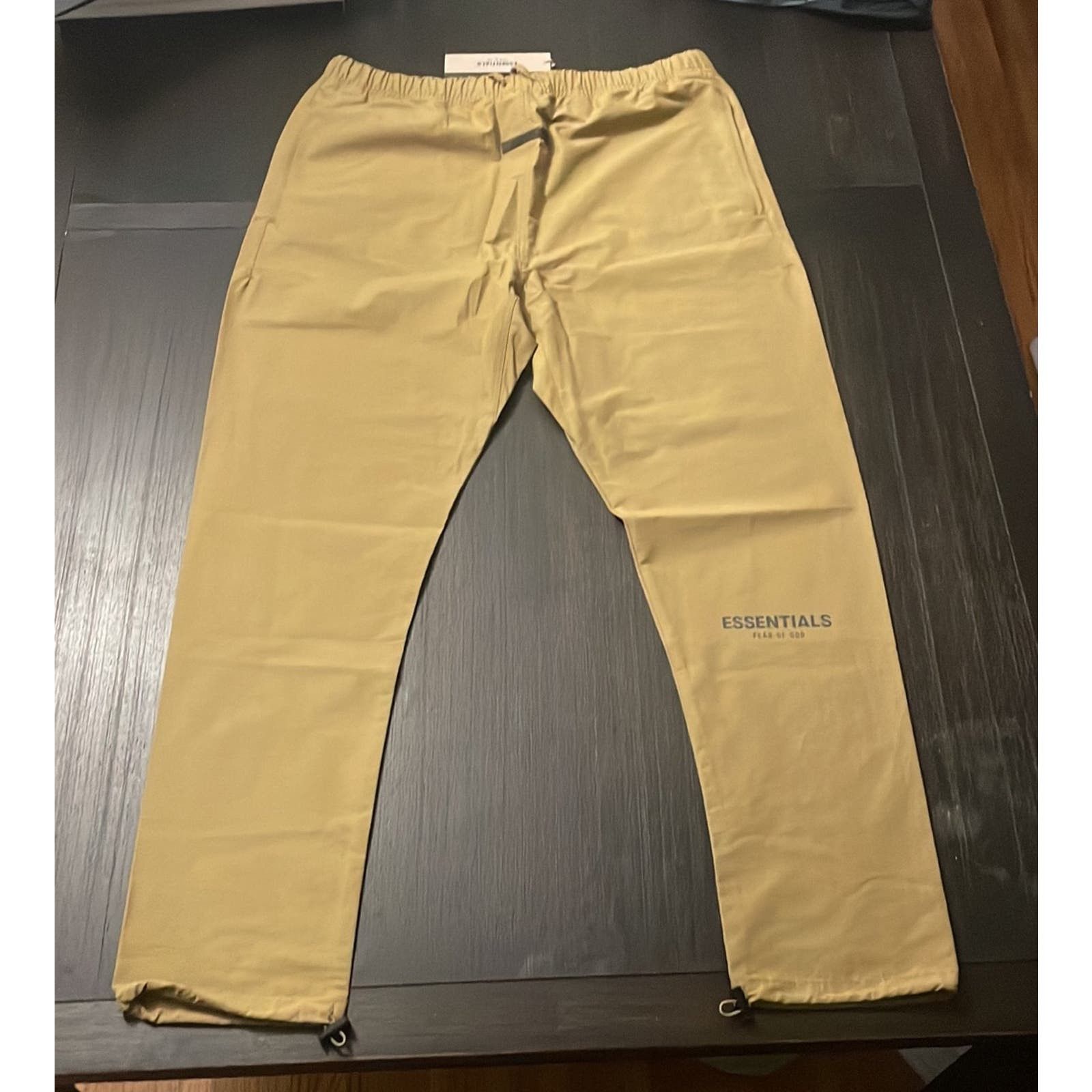 image of Fear Of God Essentials Fog Amber Gold Track Pants Xlarge, Men's (Size 36)