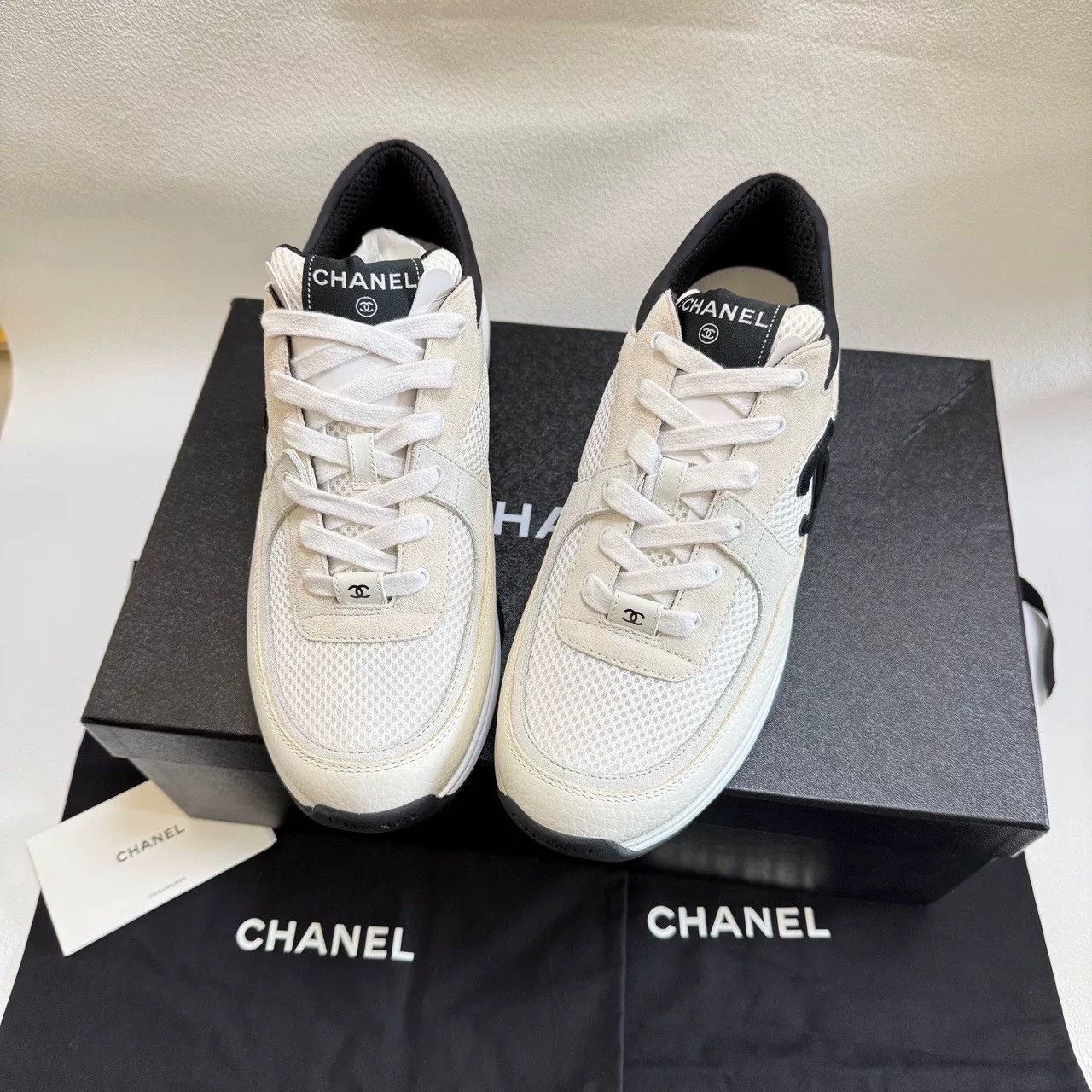 chanel black and white low-top sneakers