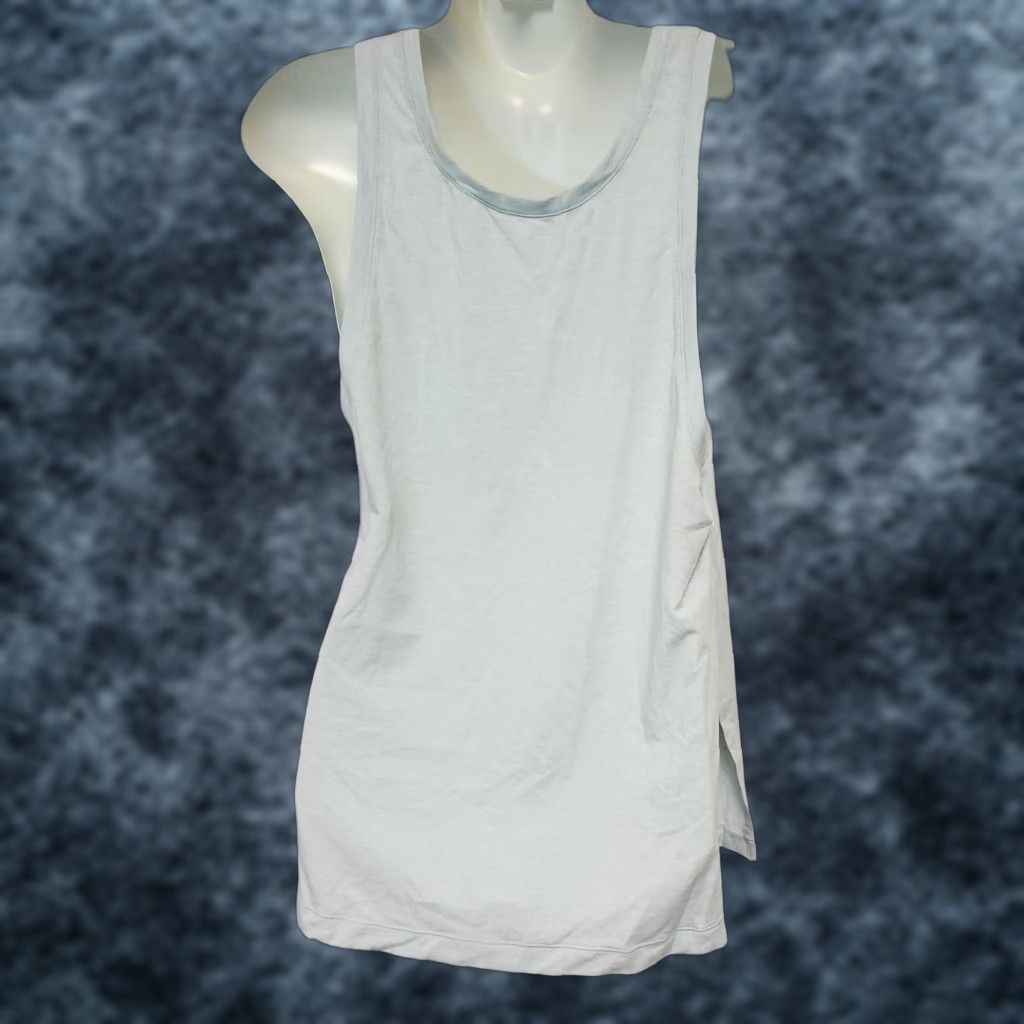 New Balance Womens New Balance Tank Top Shirt Transform 2 Way WT83121 Ice Blue High Split 74% Polyester / 18% Lyocell / 8% Elastane Sxs? Size S / US 4 / IT 40 - 1 Thumbnail