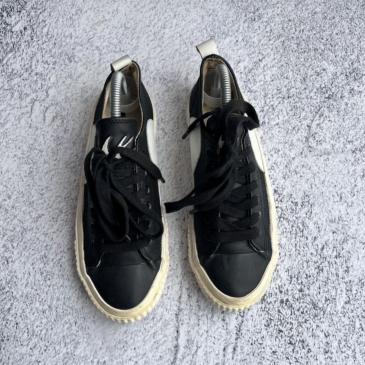 Alexander McQueen Black leather swallow plimsoll sneakers