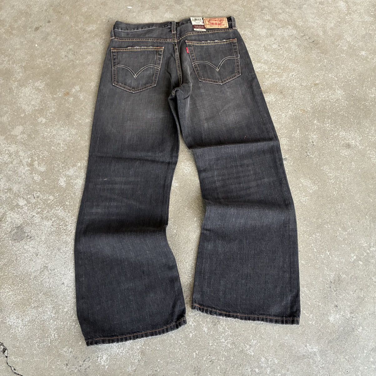 Levi's Levi's 567 Low Loose Boot Cut Faded Black Jeans | Grailed