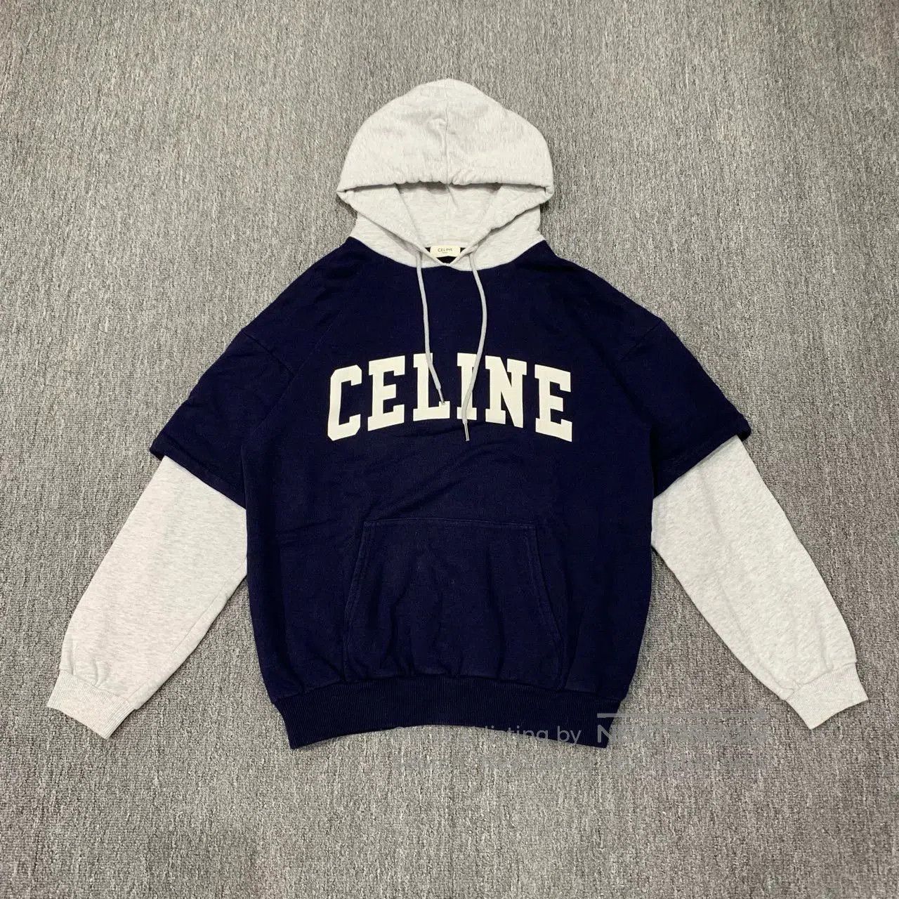 celine hooded sweatshirt with layered design.