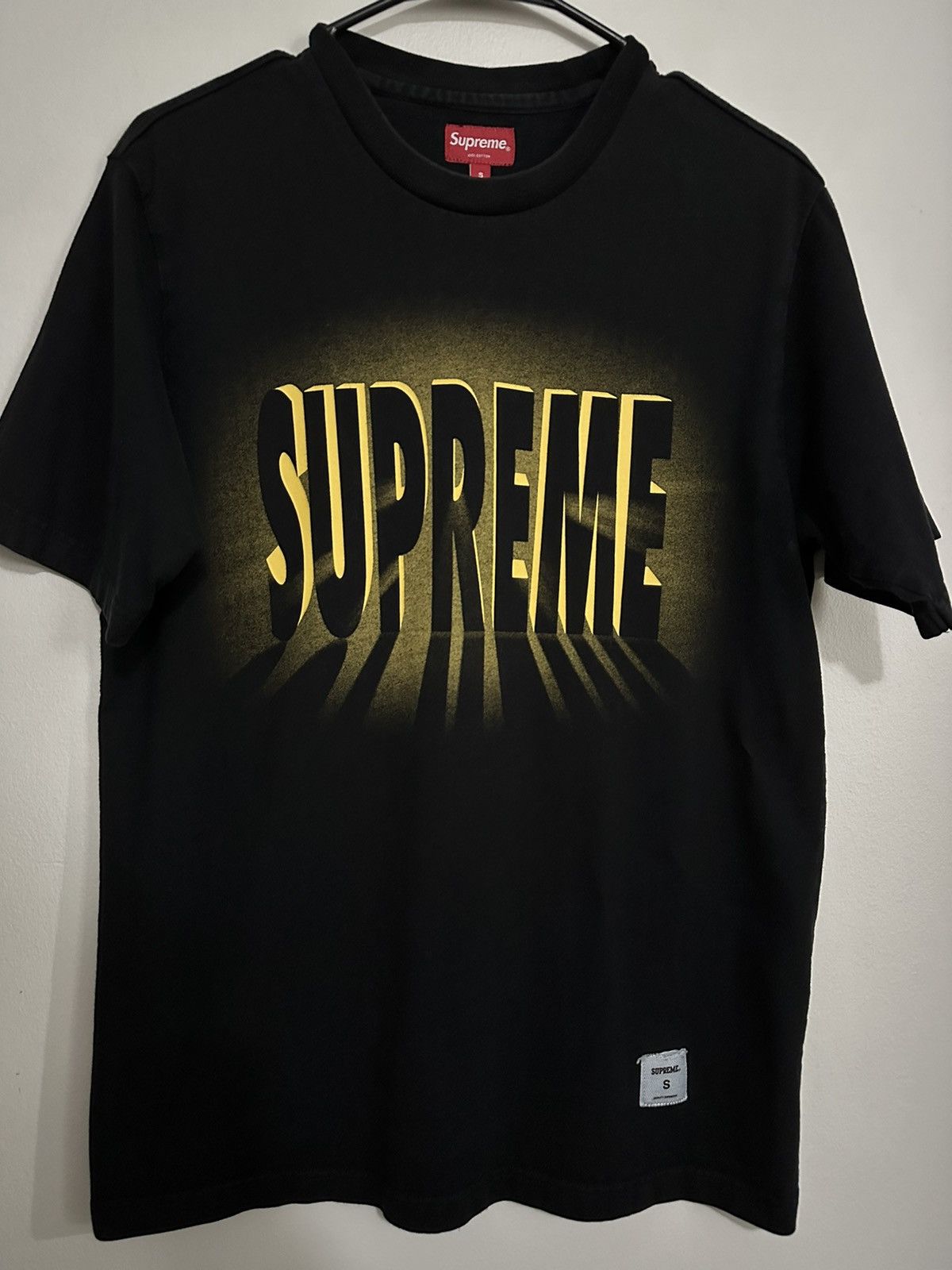 Supreme light tee hotsell