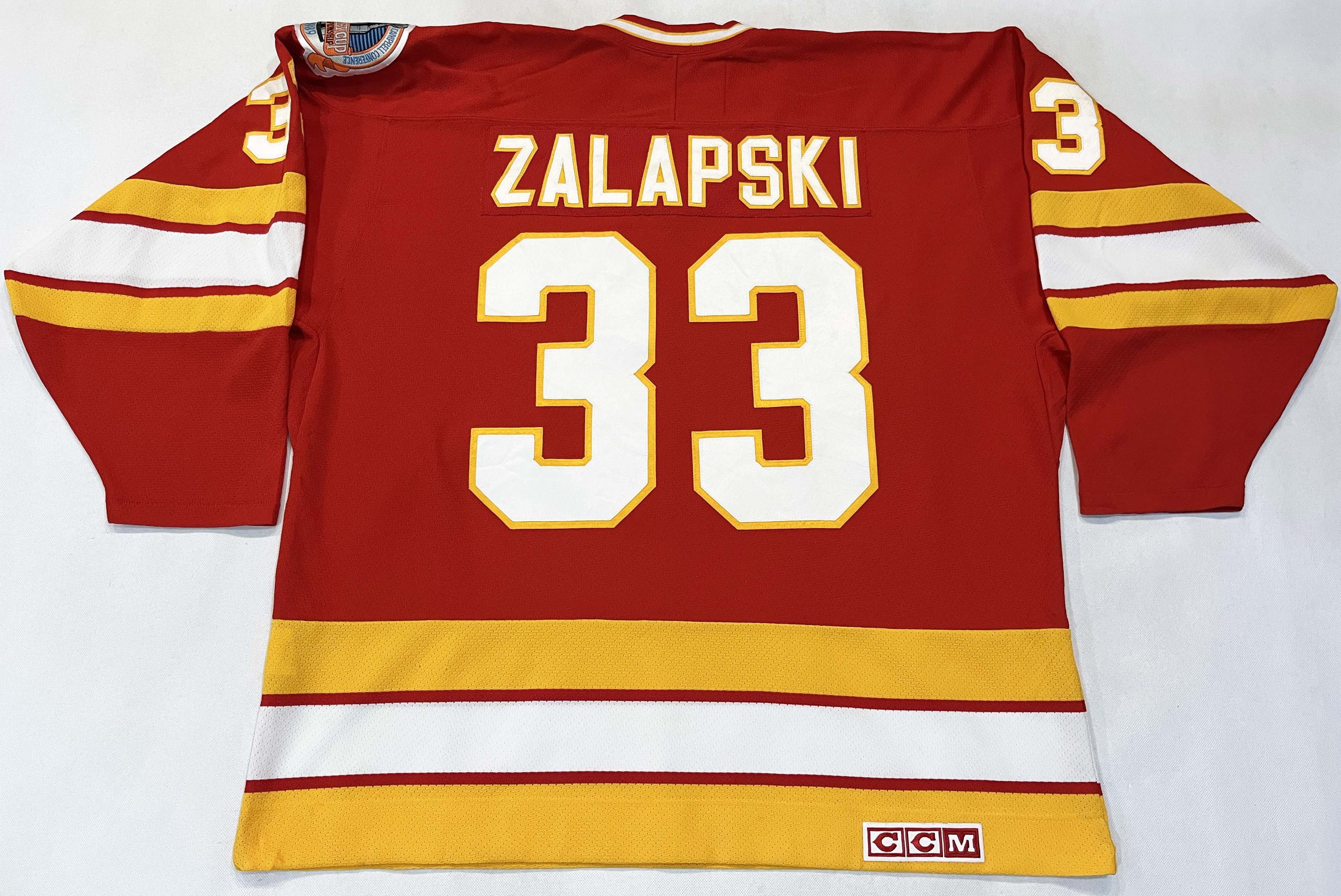 Ccm × NHL CCM Vintage Calgary Flames ZALAPSKI #33 NHL Hockey Jersey Size US XL / EU 56 / 4 - 1 Thumbnail