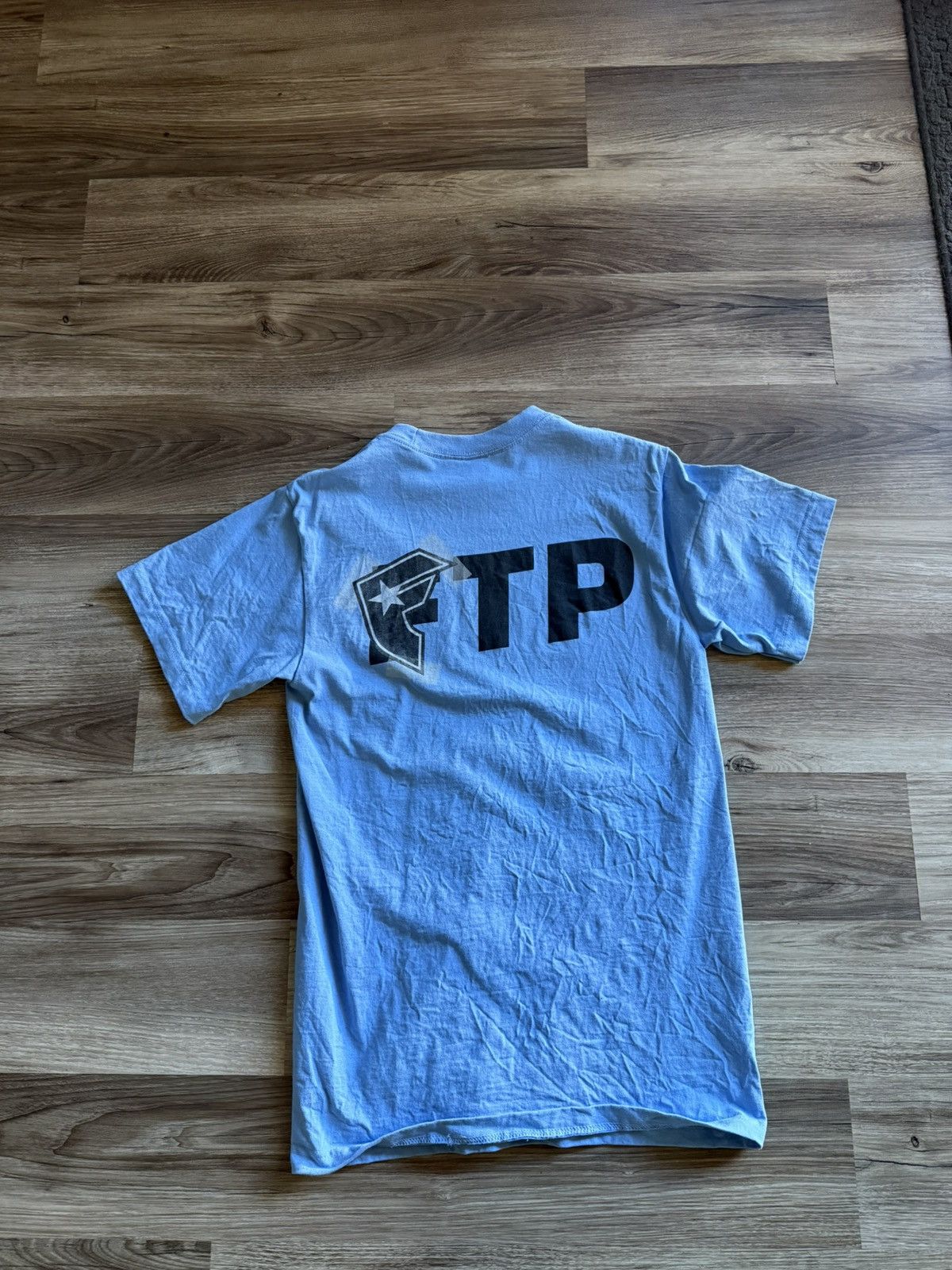 Famous Stars And Straps × Fuck The Population FTP Famous Logo Tee Sky Blue size Medium Size US M / EU 48-50 / 2 - 5 Thumbnail
