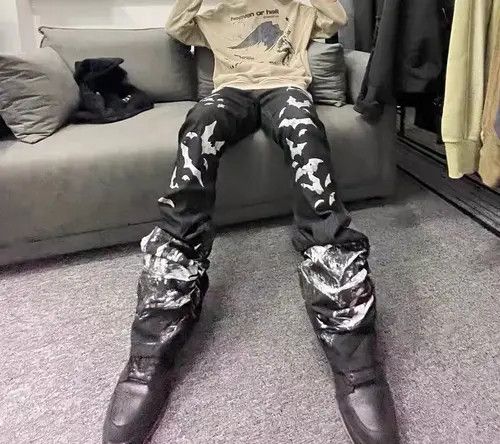 VIBE Washed distressed pleated micro-flare bat-print jeans Size US 32 / EU 48 - 8 Thumbnail