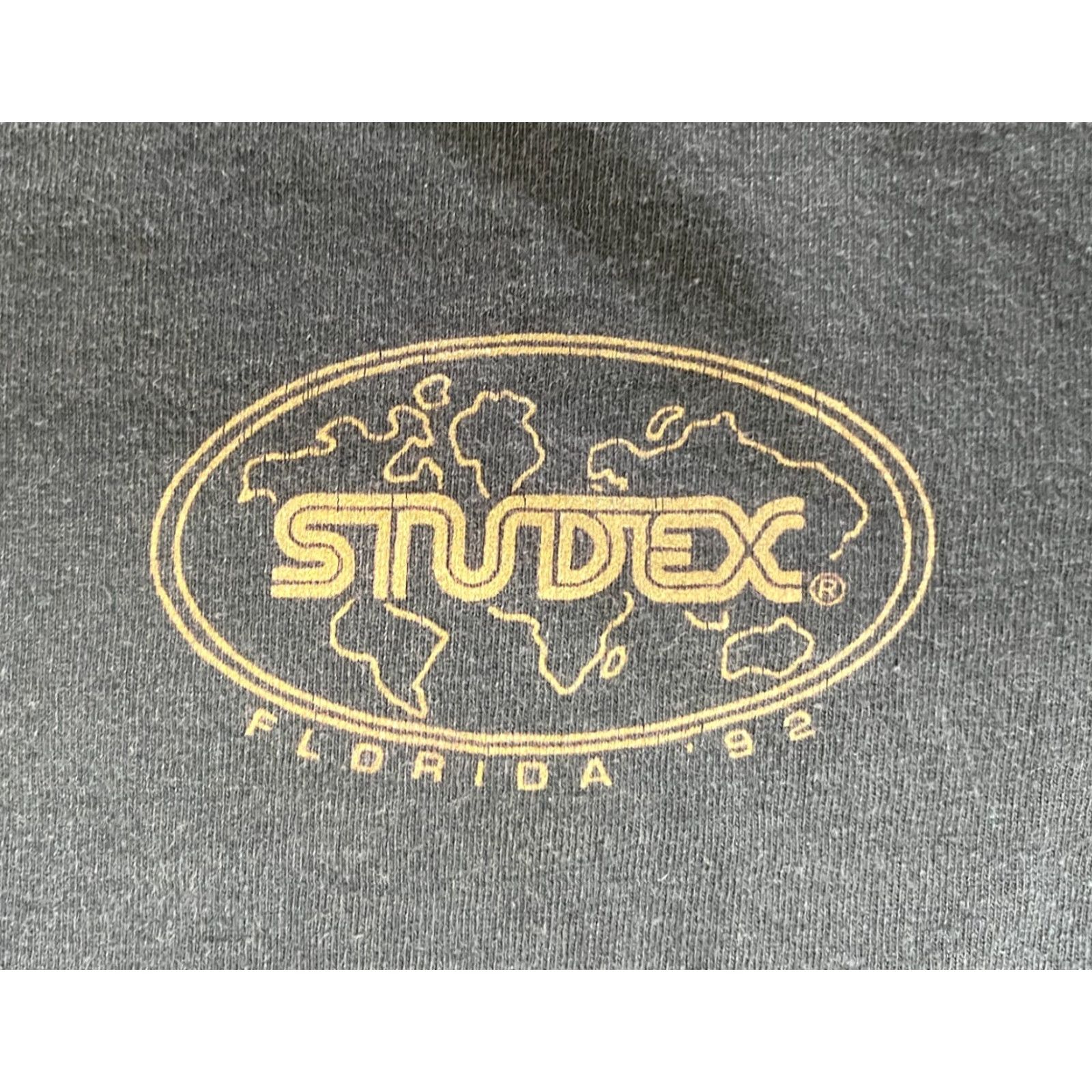 Lee VINTAGE Florida Studex Ear Piercing Equipment T-Shirt Lee Made in USA Sz L Men’s Black 1992 90s Vintage Graphic Print Shirt Size US L / EU 52-54 / 3 - 6 Thumbnail