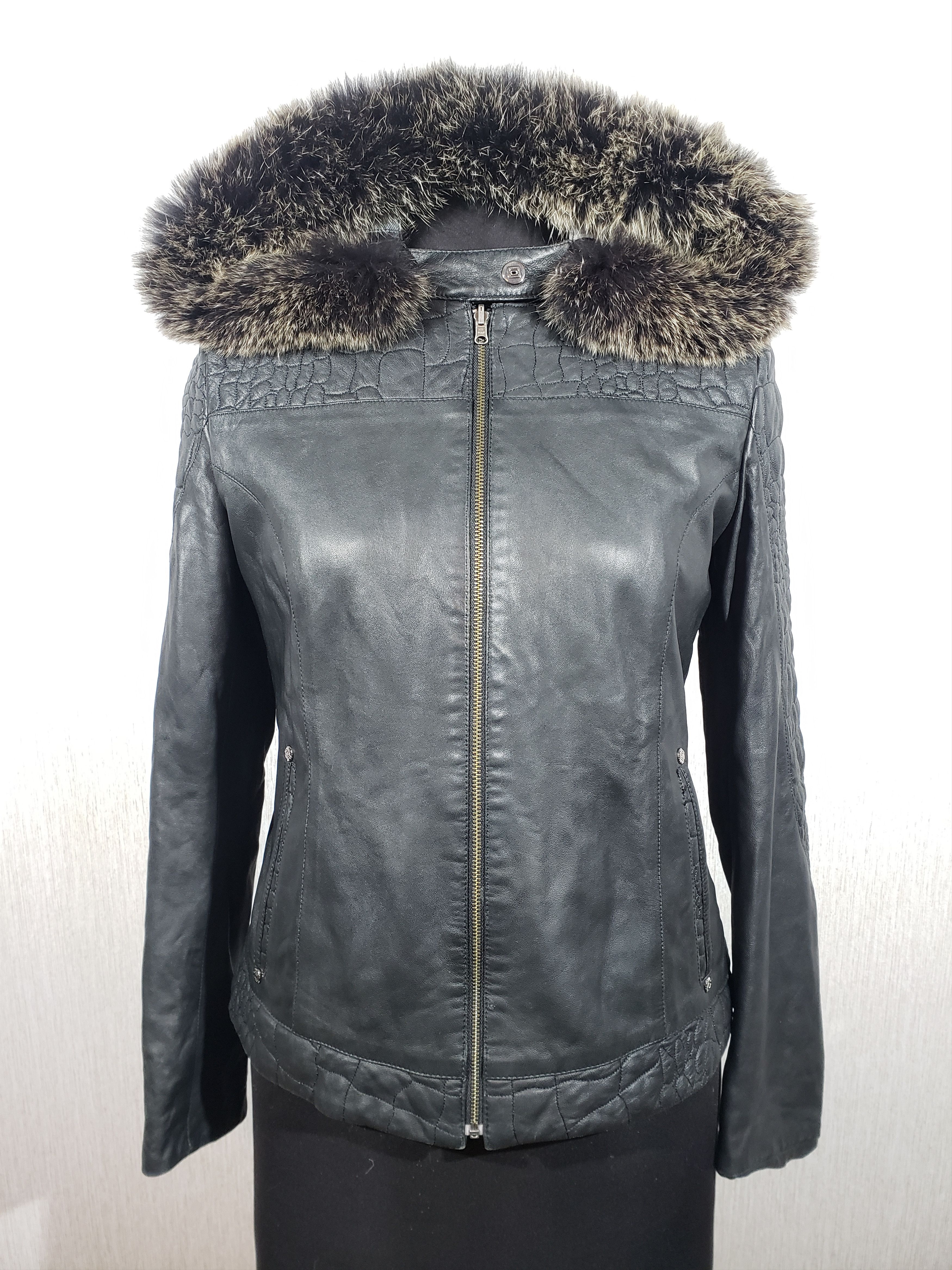 Two-sided black women's leather jacket with a hood.