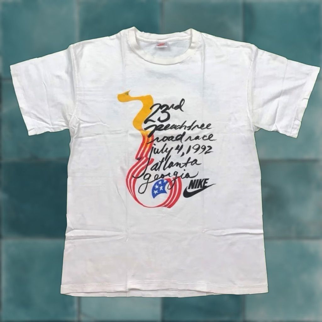 Nike VINTAGE Nike T Shirt Mens XL Peach Tree Georgia Atlanta USA 1992 July 4 80s 90s Graphic Tee White Crew Neck Short Sleeve Sportswear/Beach Mens Size US XL / EU 56 / 4 - 1 Thumbnail