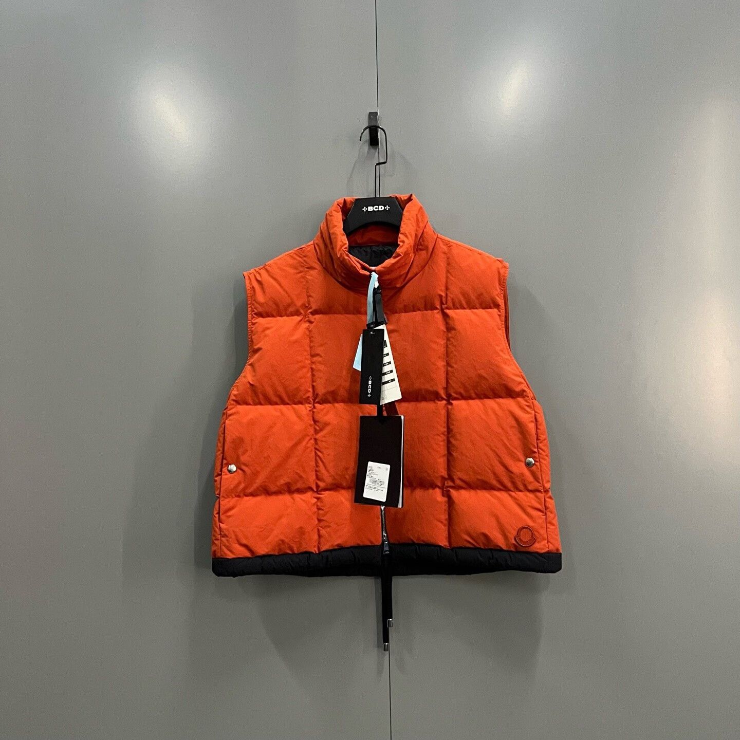 bright orange logo puffer vest