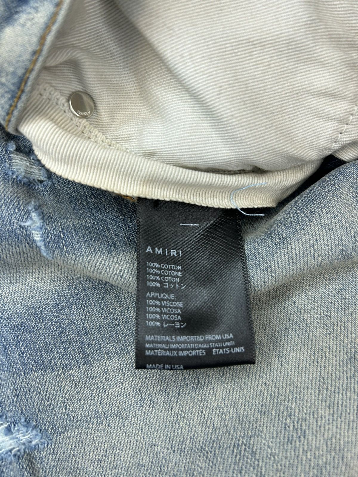 AMIRI MX1 CRACKED PAINT JEANS - CLAY INDIGO/PINK