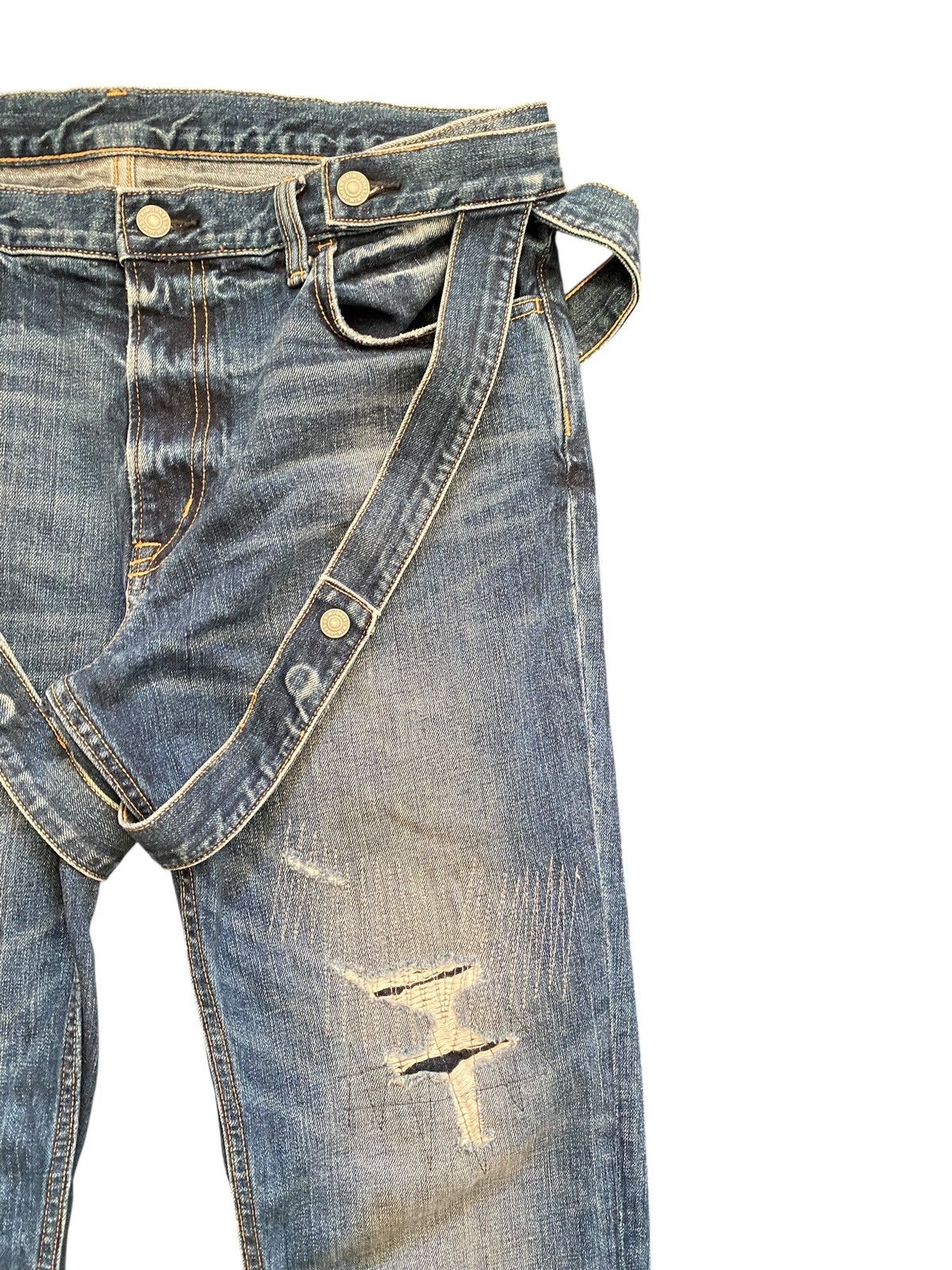 Kim Jones x GU distressed bondage denim