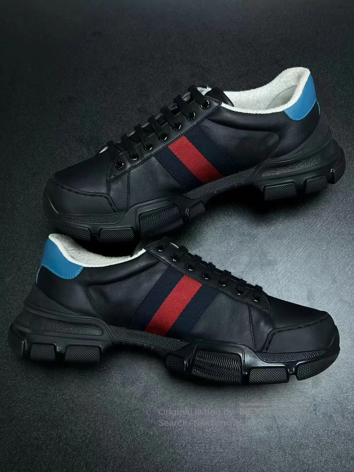 Black Low-Top Sneakers with Red and Blue Stripes.