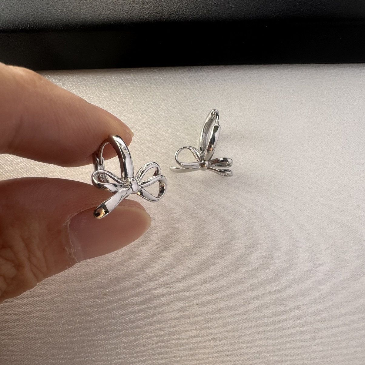 Designer Huggie Bow Silver Hoop Earrings for Women Size ONE SIZE - 4 Thumbnail