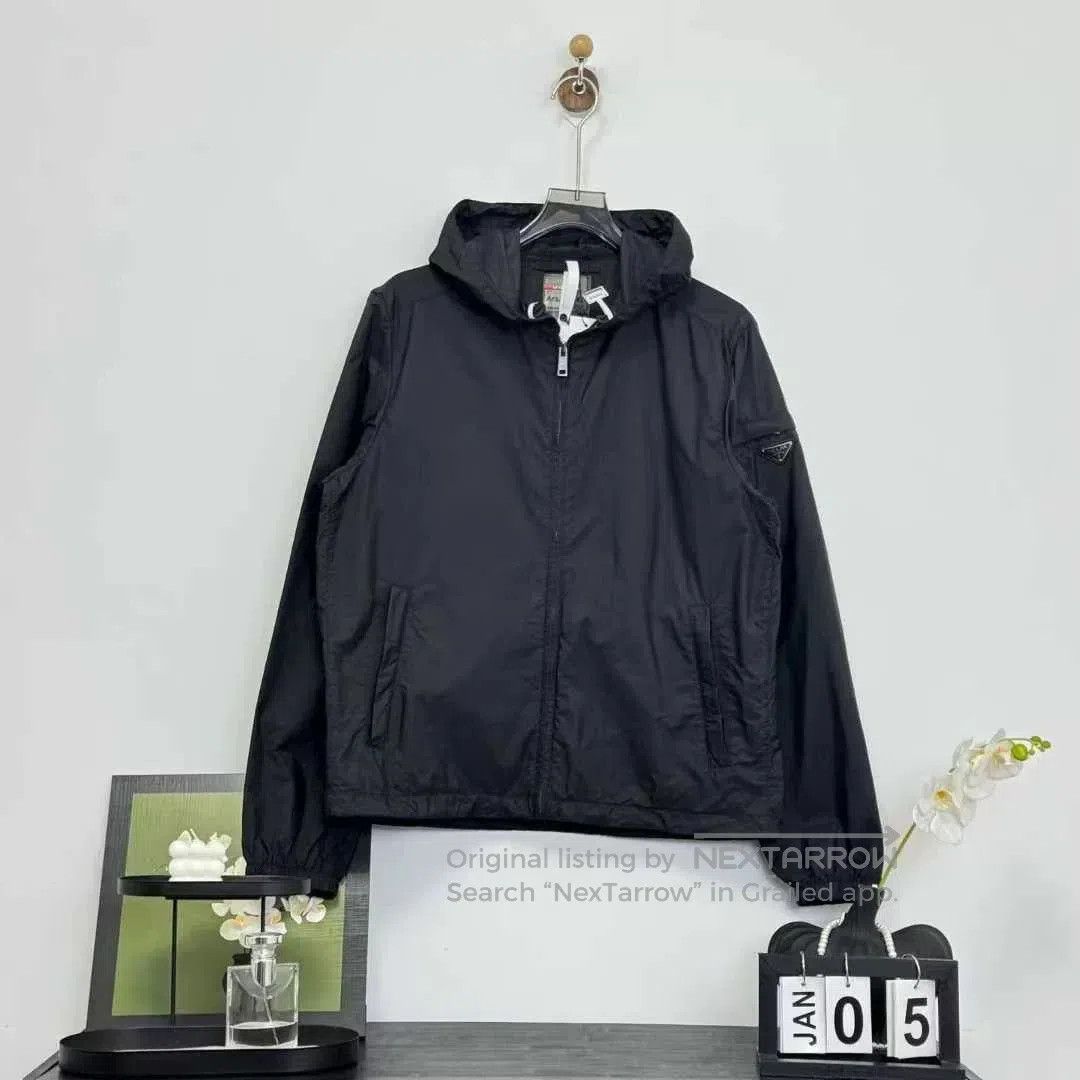 prada black nylon coat with metal logo.