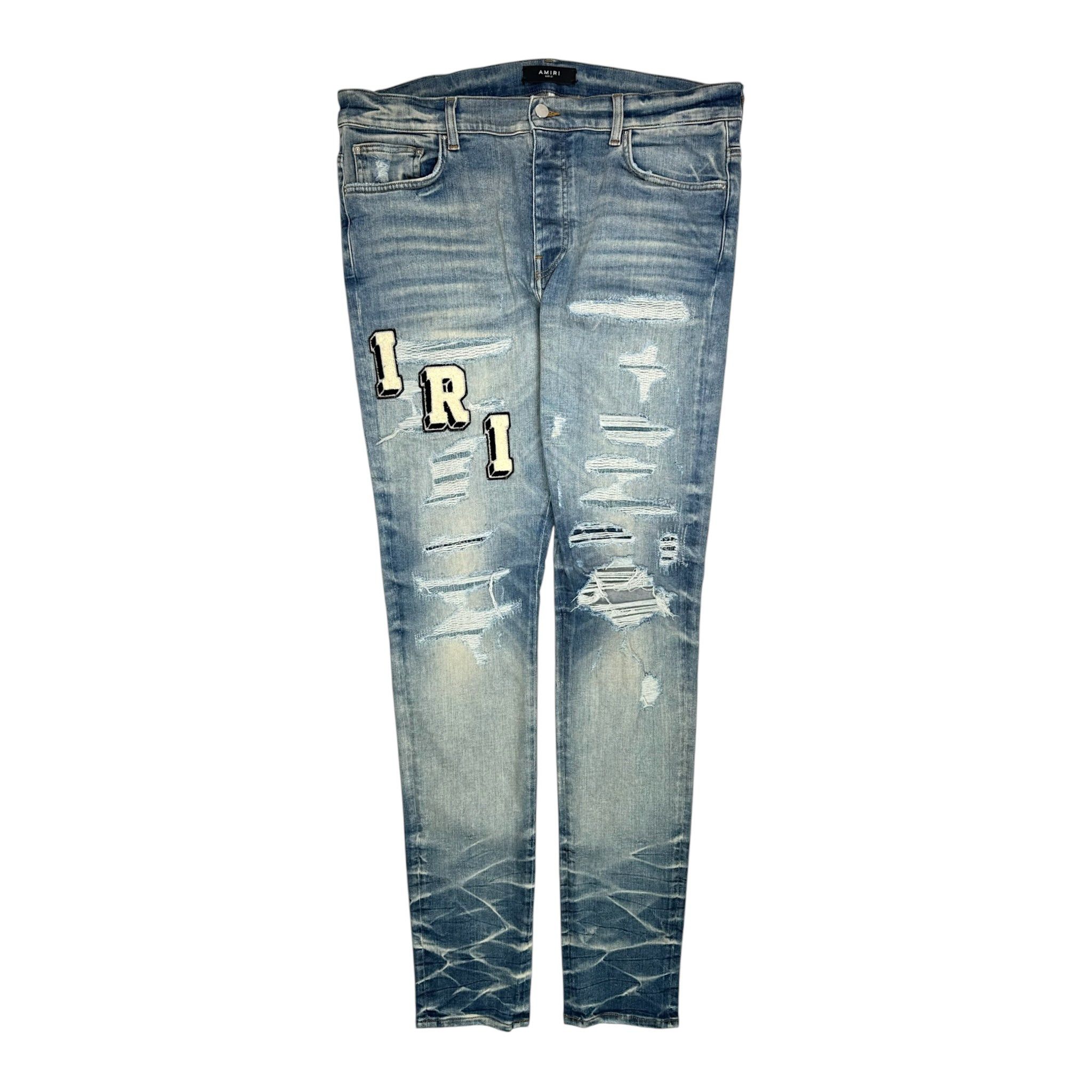 Amiri Amiri Distressed Varsity Logo Jeans Vintage Indigo | Grailed