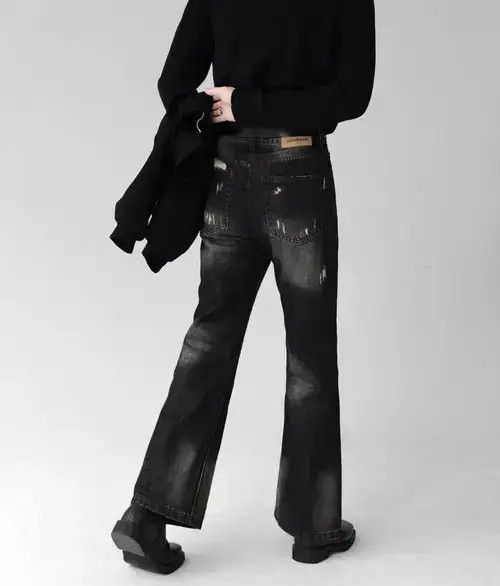 Smoky gray distressed micro-flared denim trousers