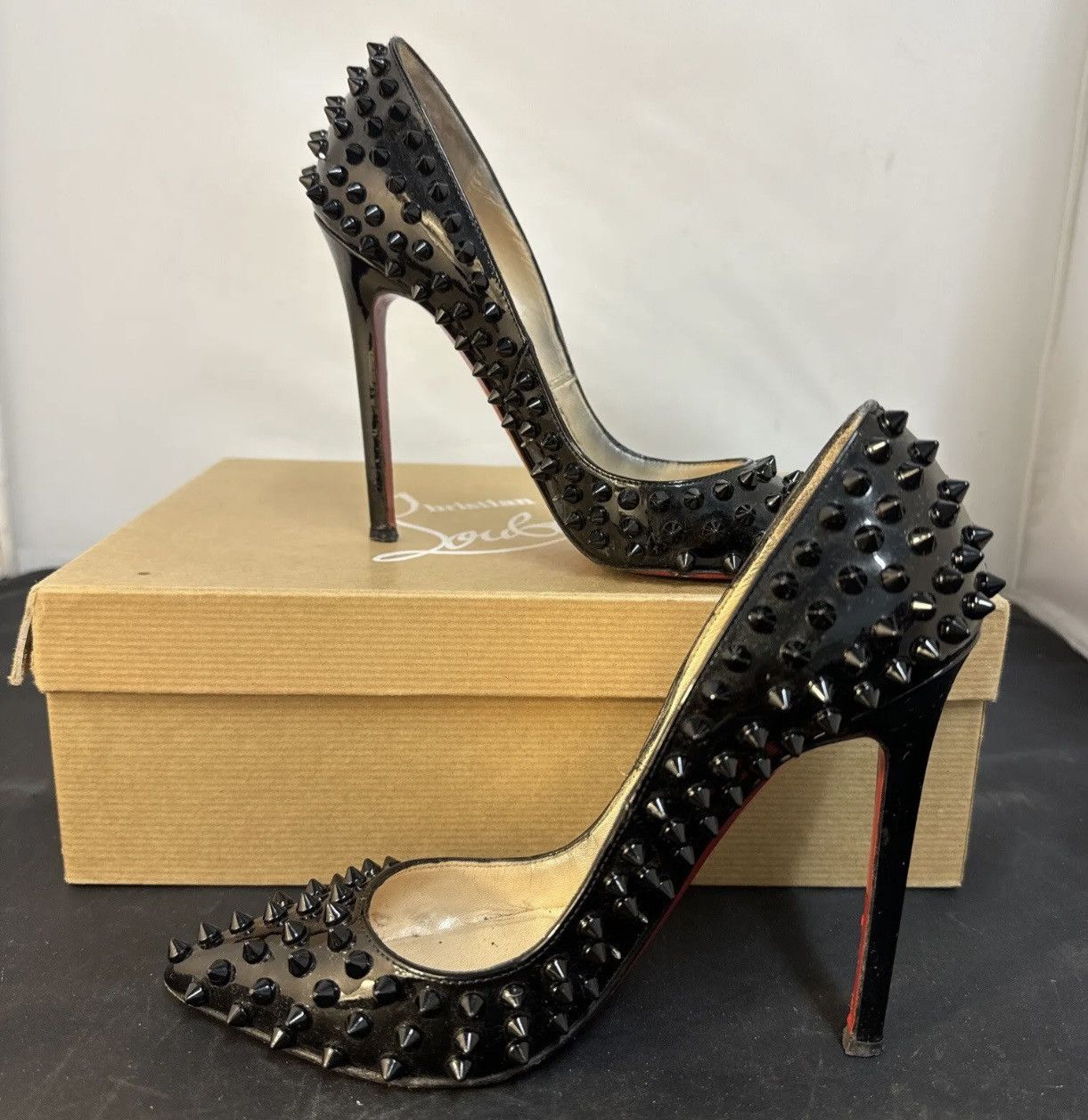 image of Christian Louboutin Black Pigalle Spikes Red Bottom Stiletto Shoes, Women's (Size 4)