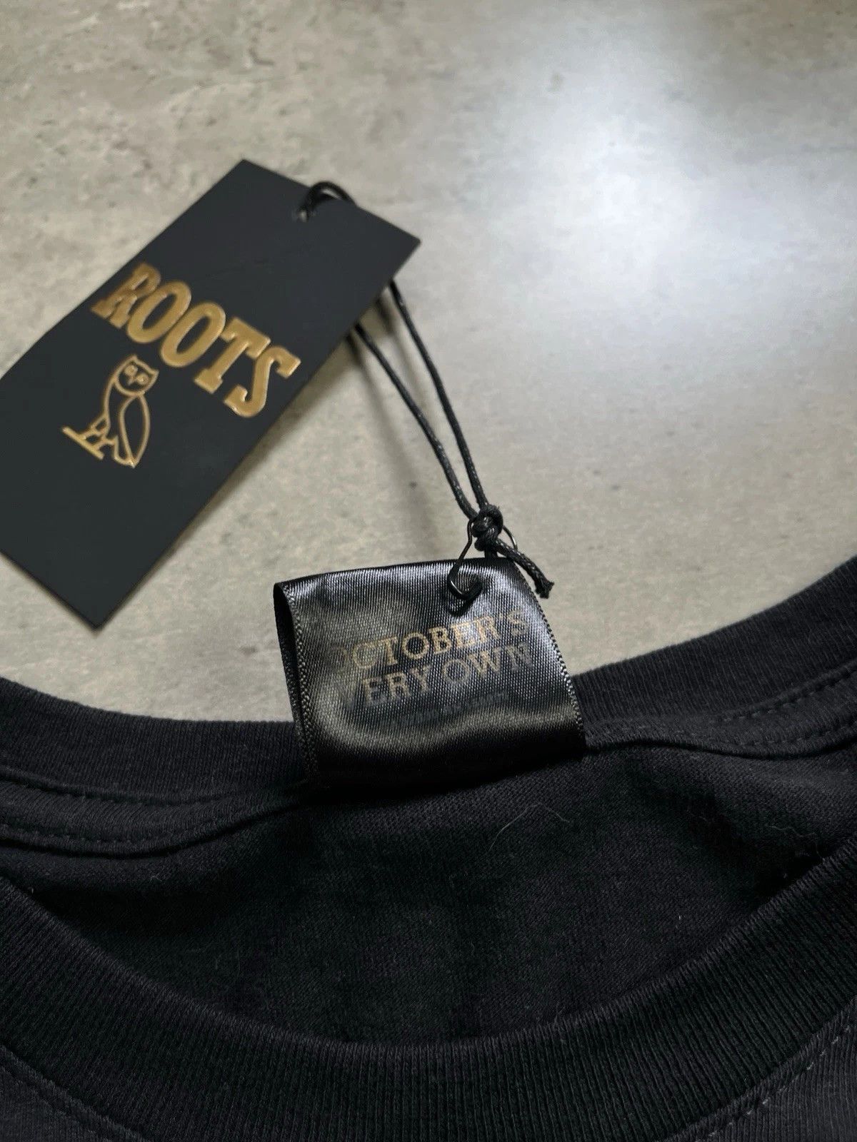 October's Very Own × Roots OVO October's Very Own x Roots Owl Tee Size US L / EU 52-54 / 3 - 10 Thumbnail