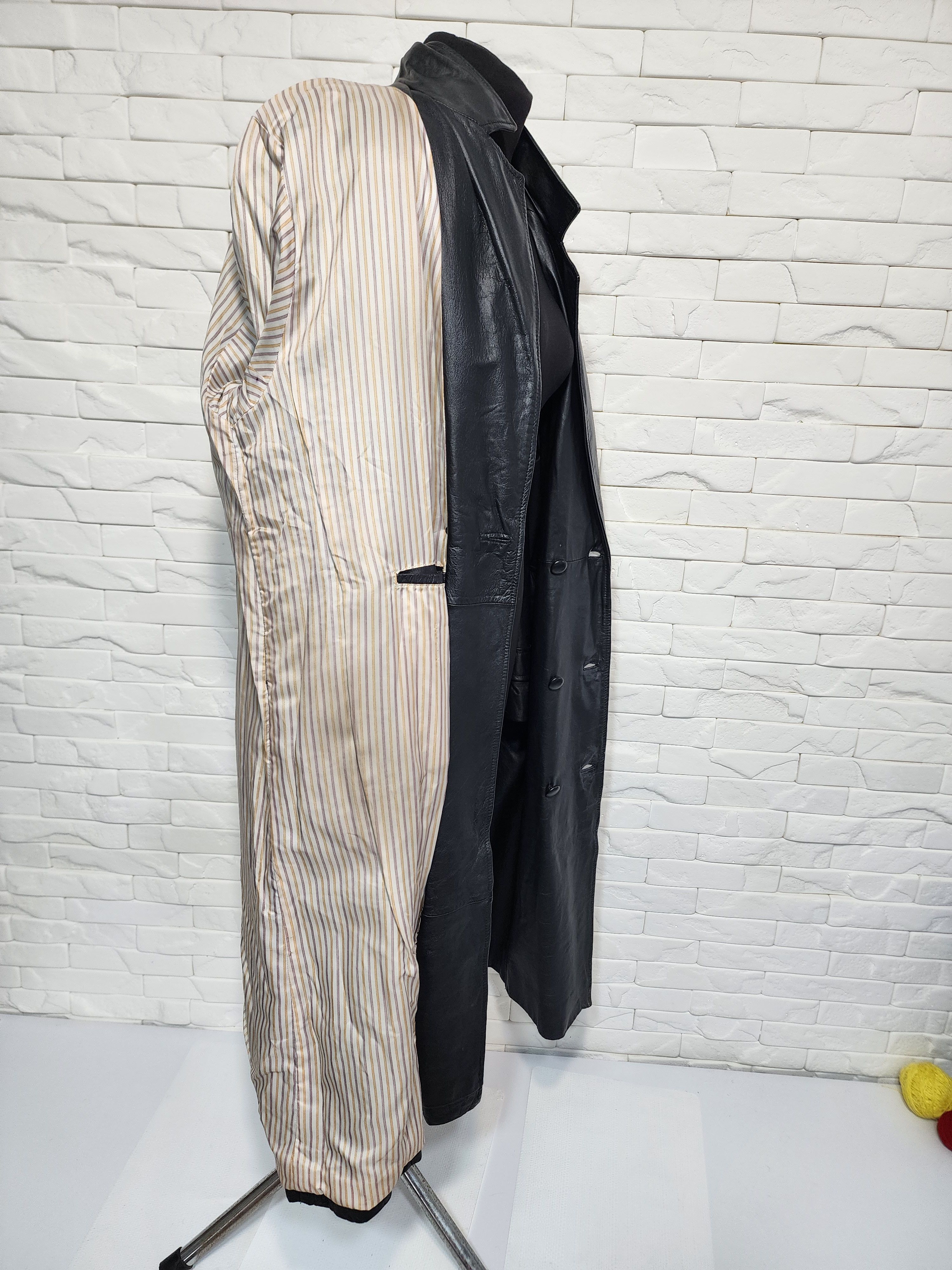 Women black leather raincoat.