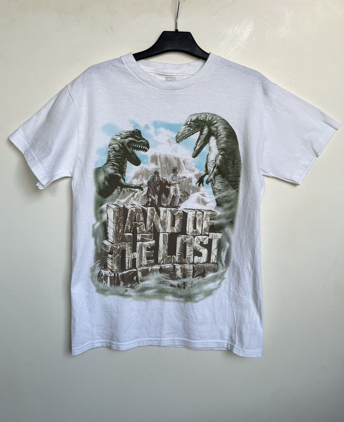 Image of Vintage Land Of The Lost Dinosaur Shirt Official Merch in White, Women's (Size Small)