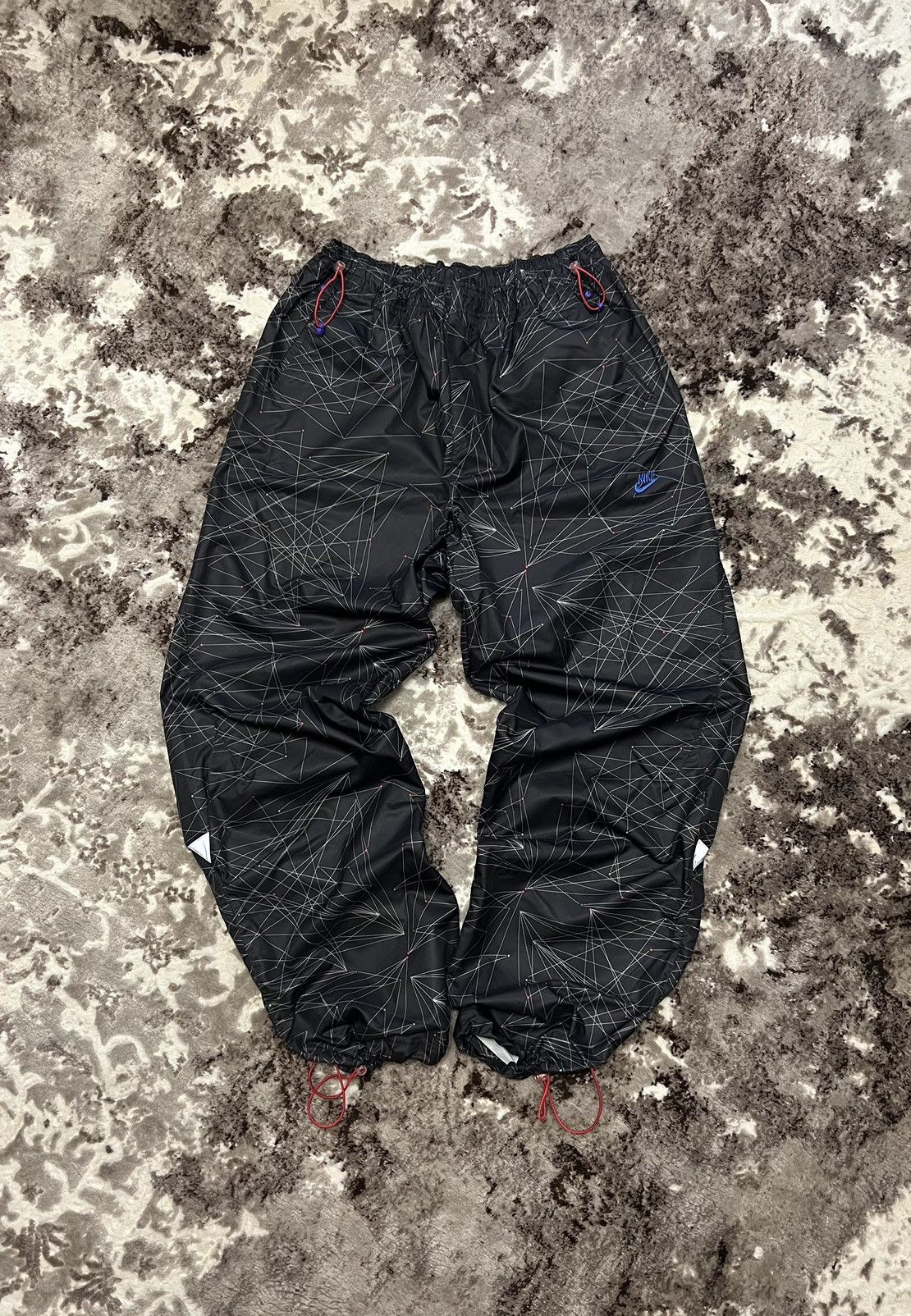 image of Nike Tn Nylon Drill Y2K Waterproof Pants in Black, Men's (Size 34)