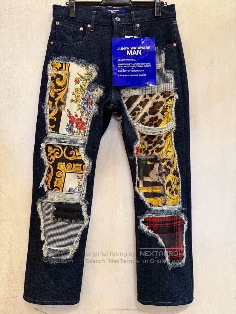 JUNYA WATANABE MAN Distressed Patch Denim Jeans.