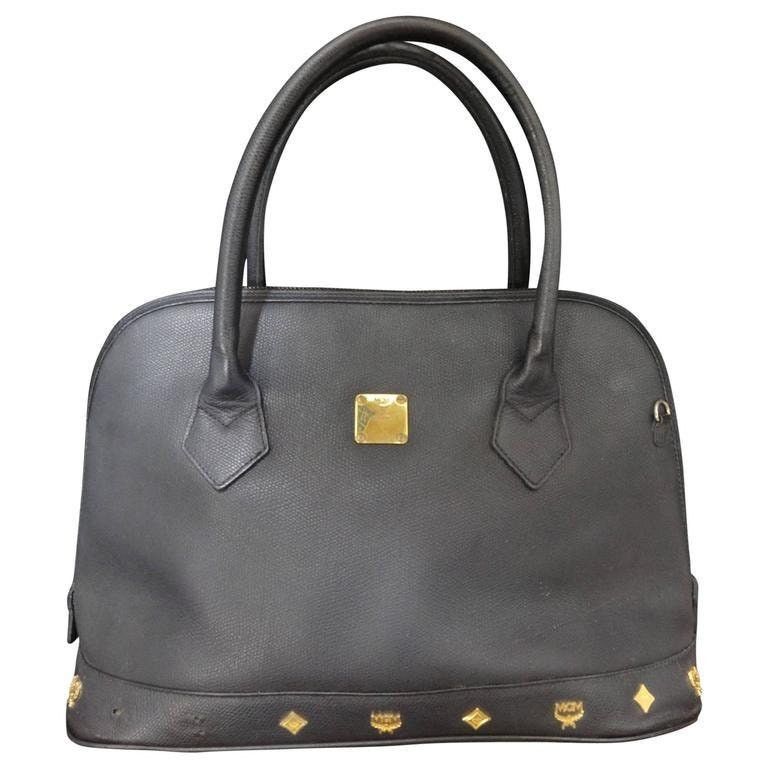 MCM Vintage MCM black bolide style bag with gold tone studs Size ONE SIZE - 1 Thumbnail