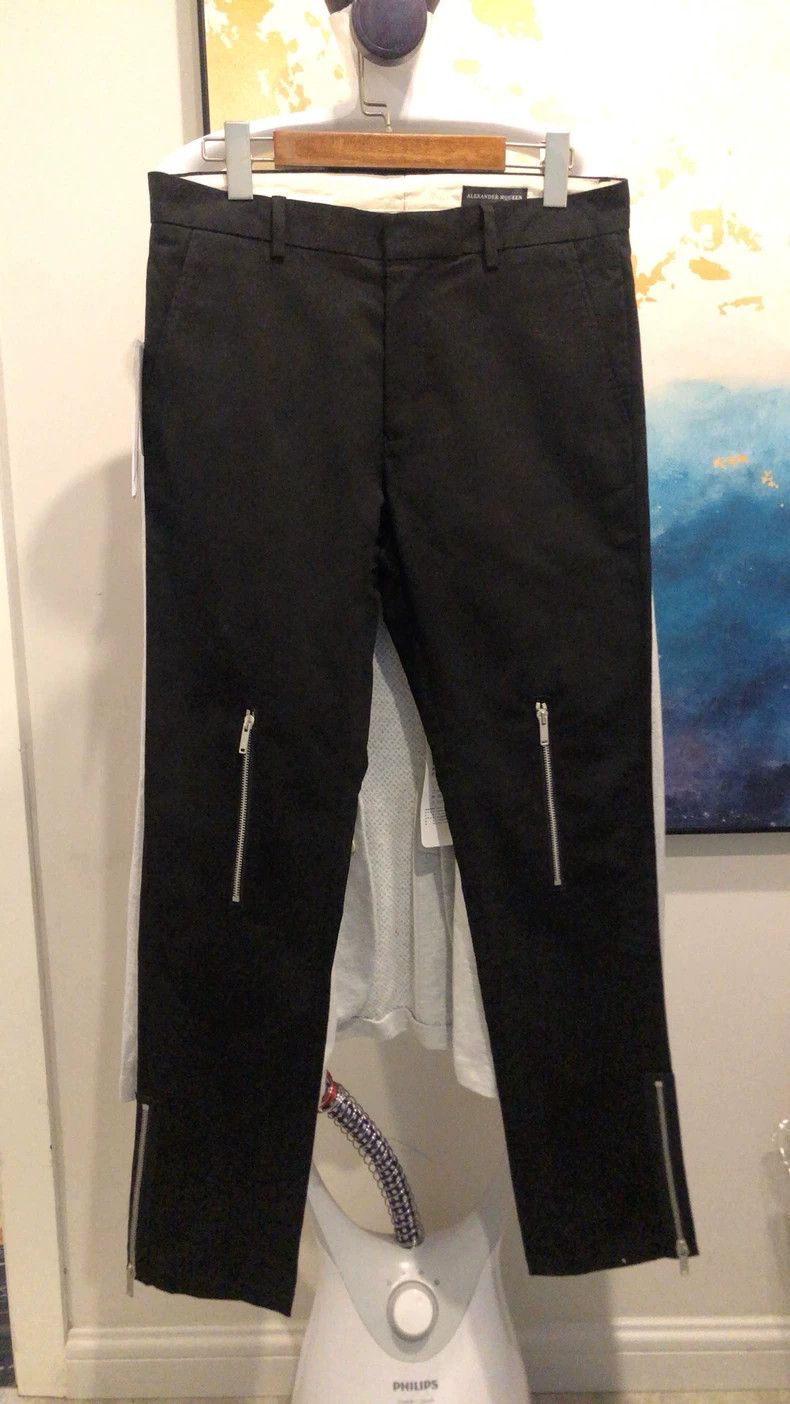 Alexander McQUEEN Men's black long pants. They feature a de