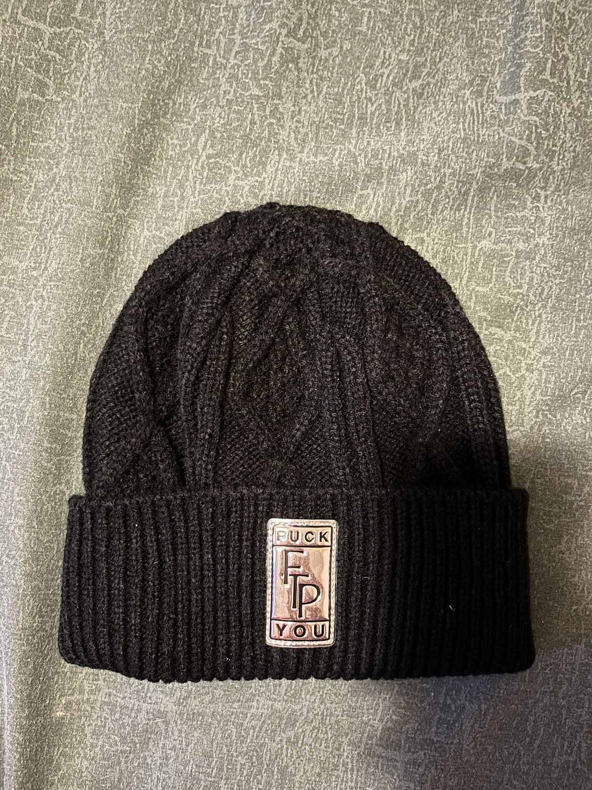 FTP Big Body cable knit beanie in hand