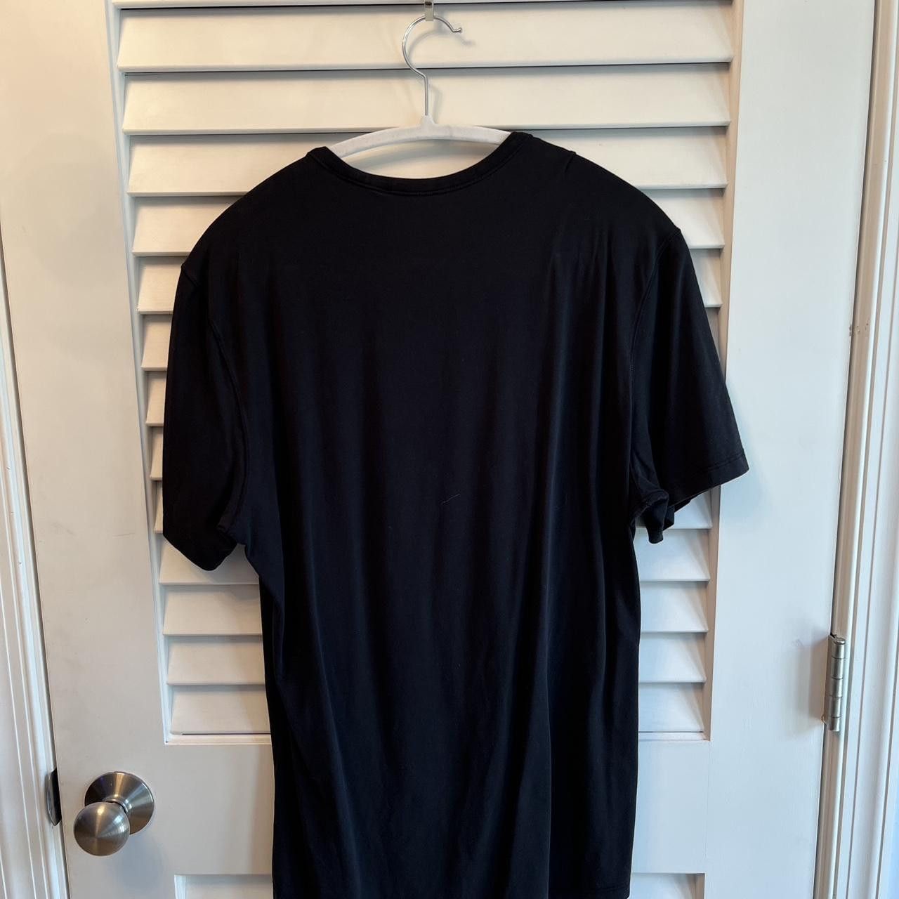 black lululemon 5 year basic T *LNY — gold logo decal