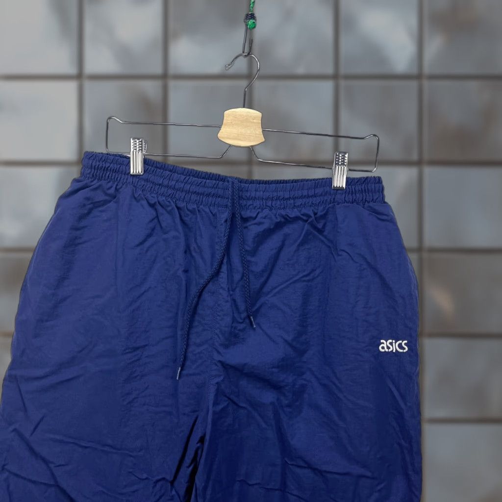 Asics VINTAGE ASICS Track Pants Men L Blue 90s Windbreaker Swishy Running Loose Drawstring Pants Size US 33 - 1 Thumbnail