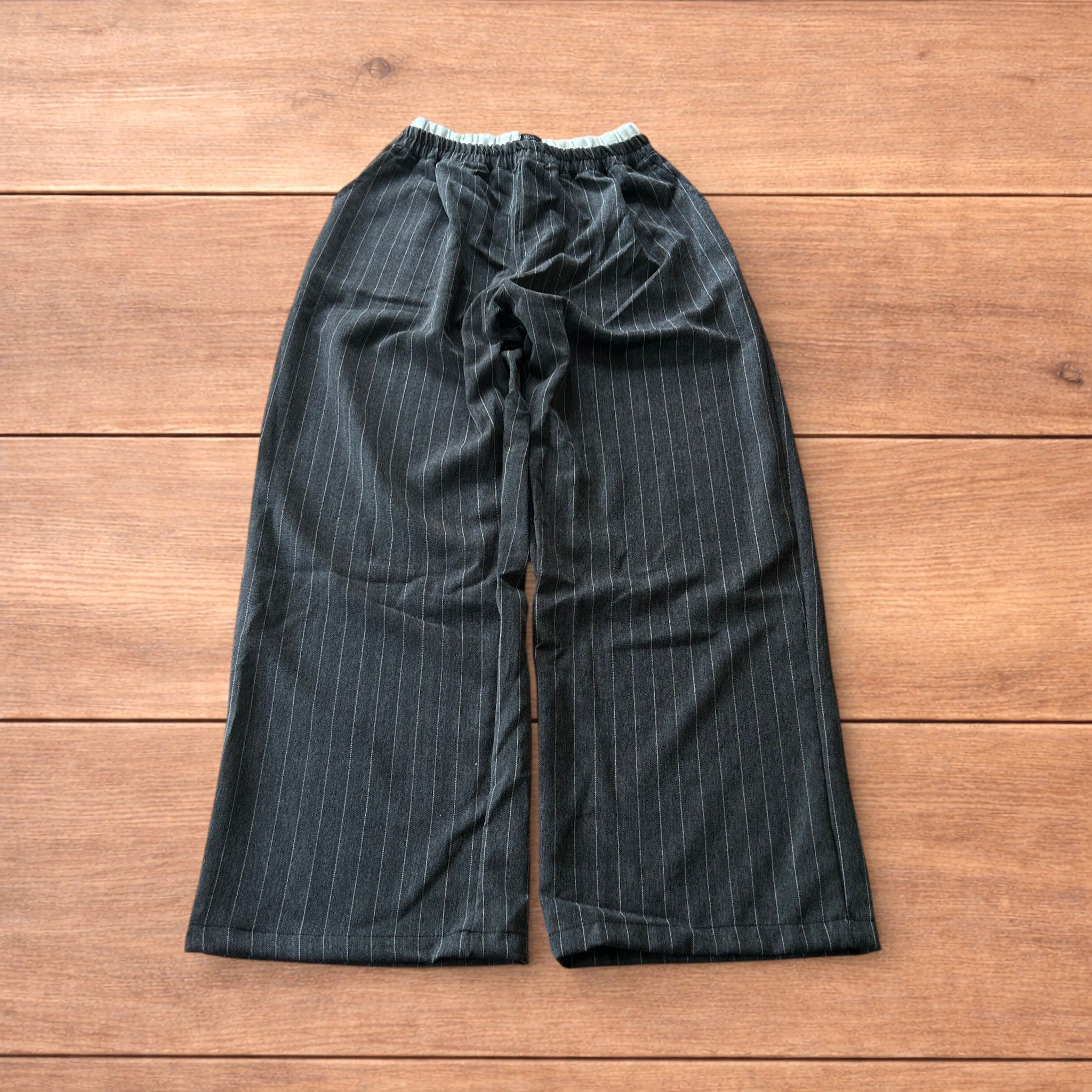Baggy wide leg pinstripe lounge pants trousers in dark grey.