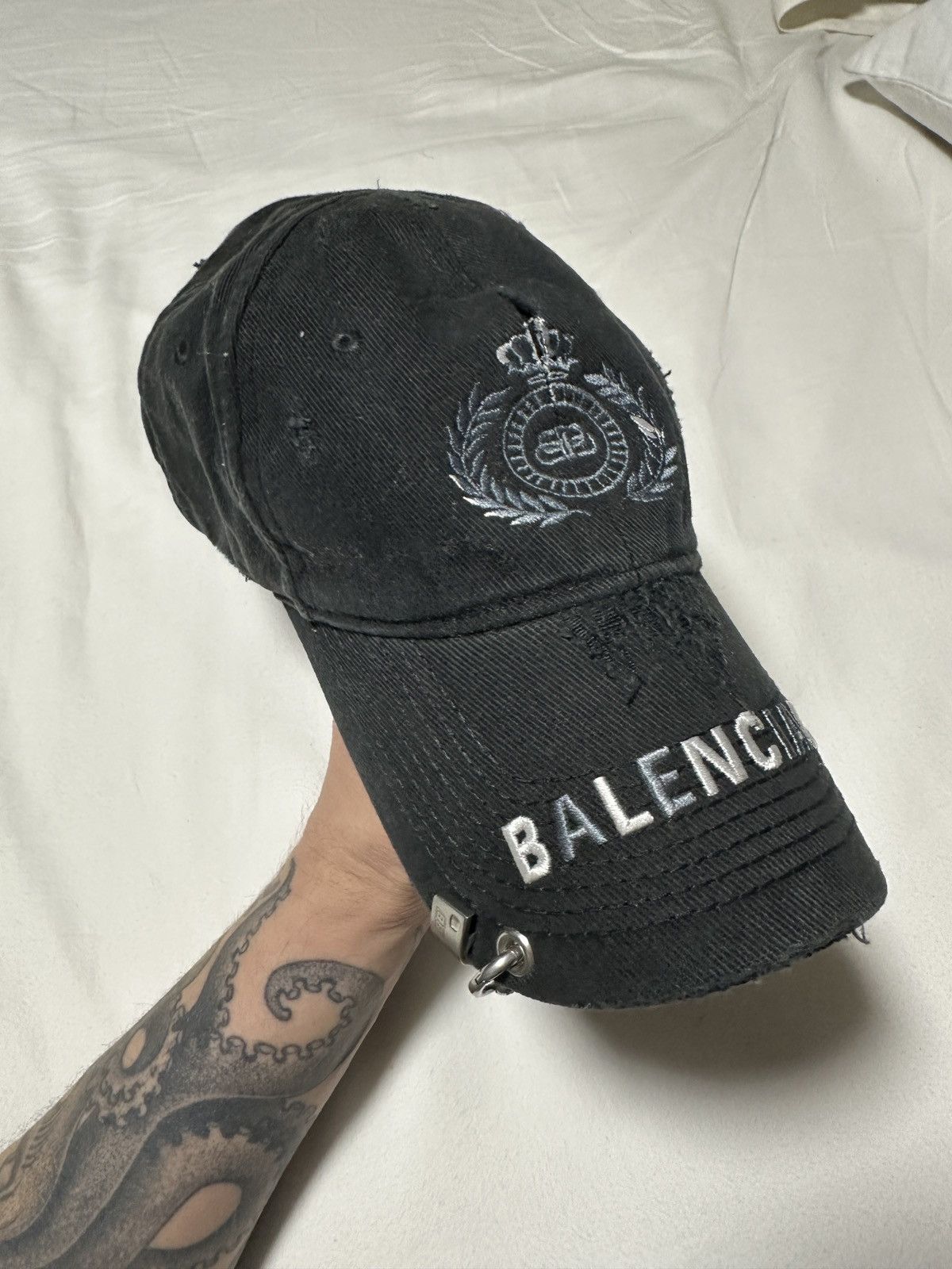 image of Balenciaga Bb Laurel Destroyed Piercing Cap in Navy, Women's